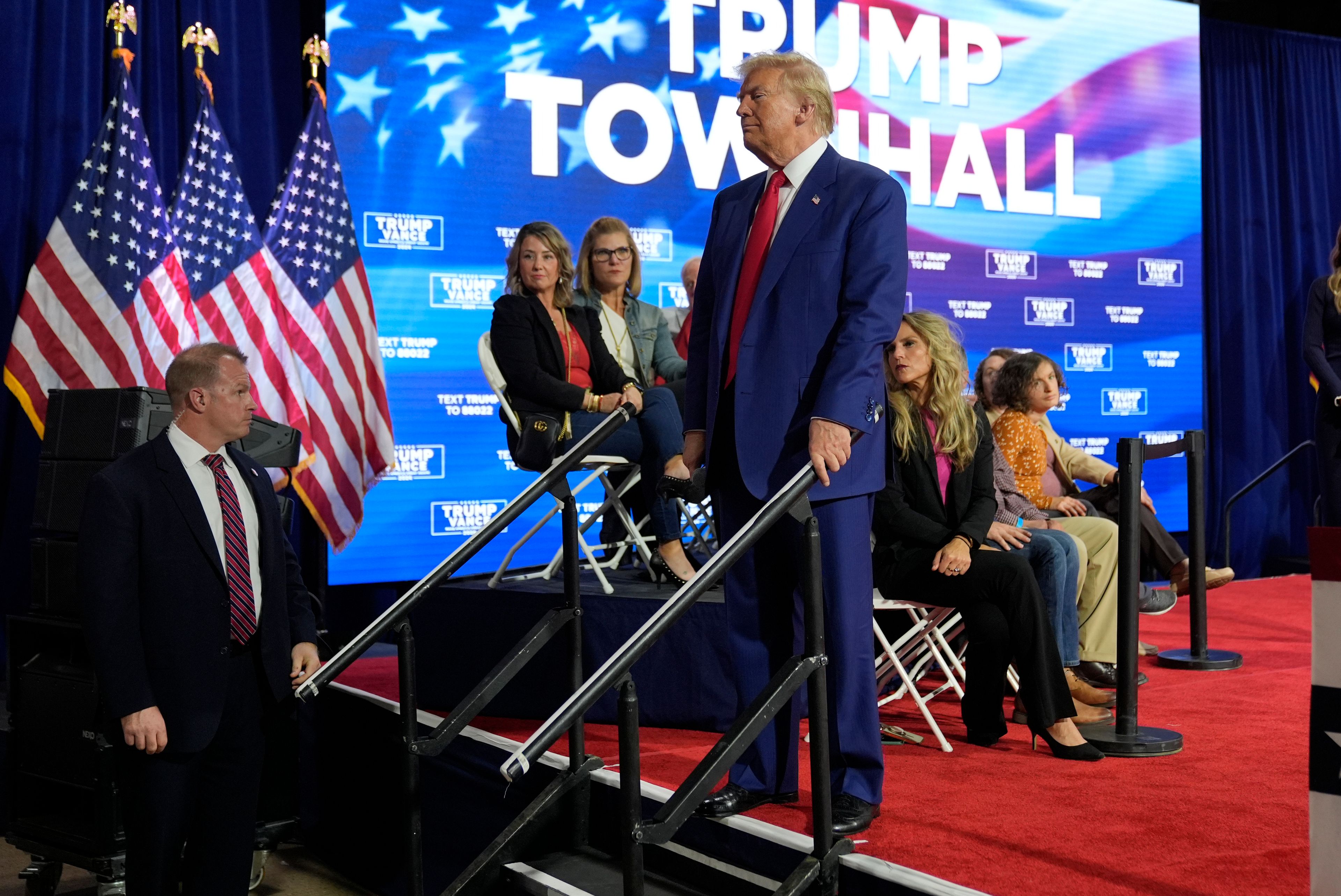 Republican presidential nominee former President Donald Trump checks on a person having a medical emergency at a campaign town hall at the Greater Philadelphia Expo Center & Fairgrounds, Monday, Oct. 14, 2024, in Oaks, Pa. (AP Photo/Alex Brandon)