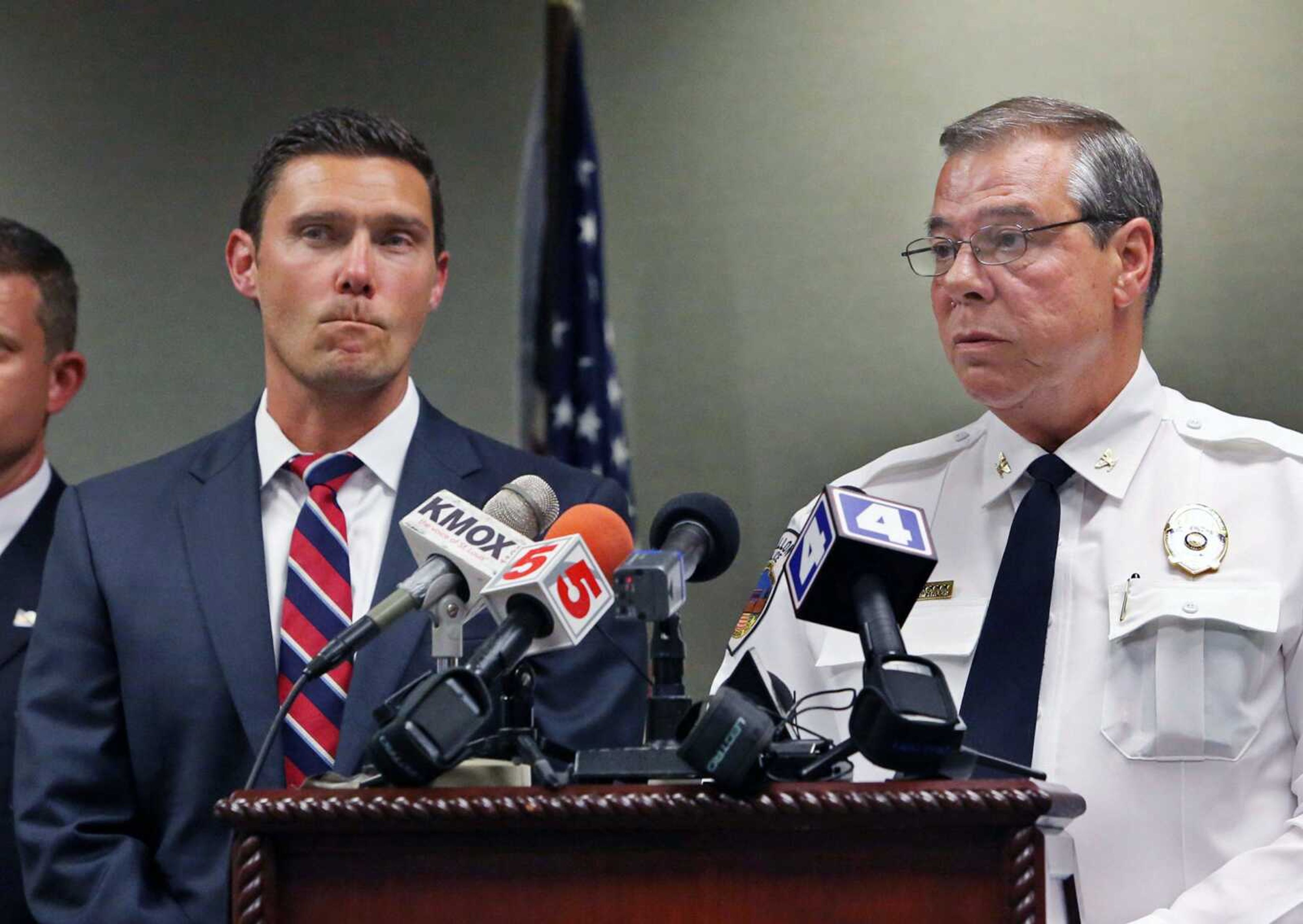 Tim Lohmar, left, prosecuting attorney for St. Charles County, and O'Fallon police chief Roy Joachimstaler speak during a news conference Tuesday in O'Fallon, Missouri.