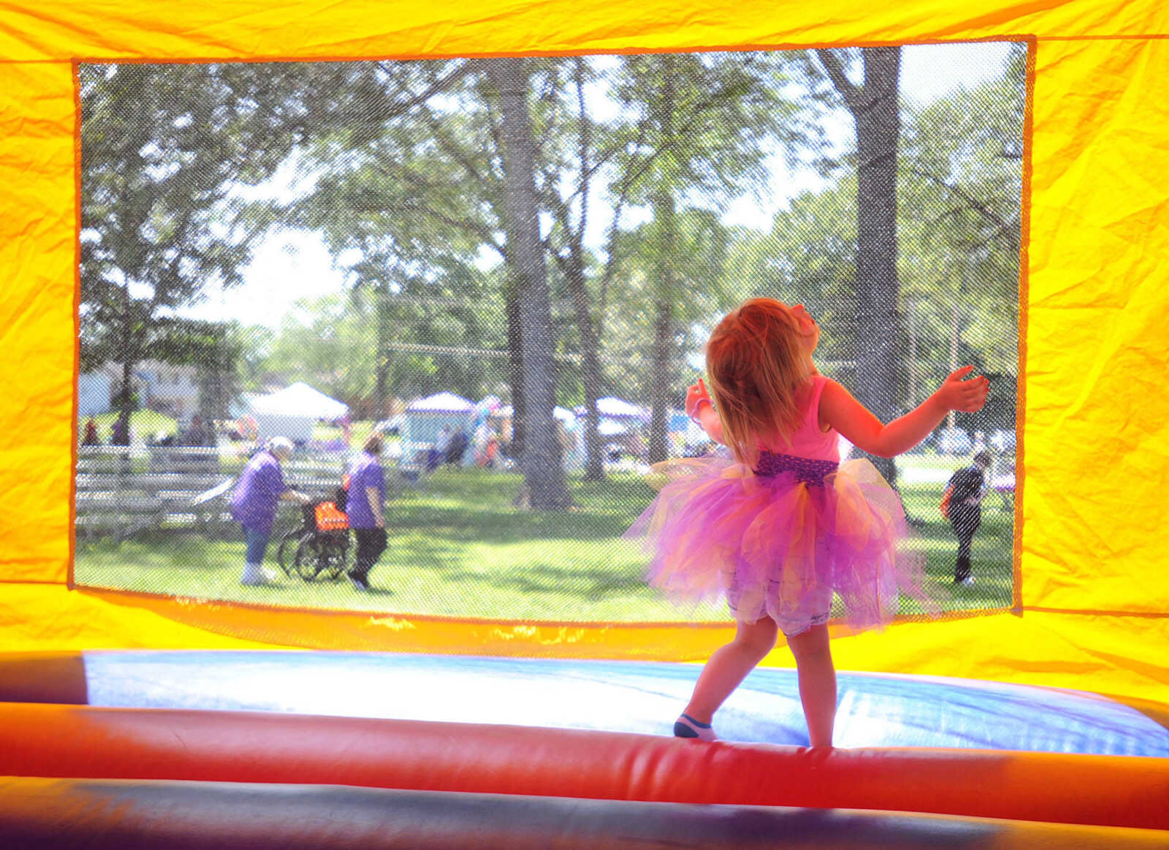 LAURA SIMON ~ lsimon@semissourian.com

Gabriella Kimmel jumps around in the bounce house, Saturday, June 14, 2014, during the Relay for Life of Cape Girardeau County fundraiser at Arena Park.