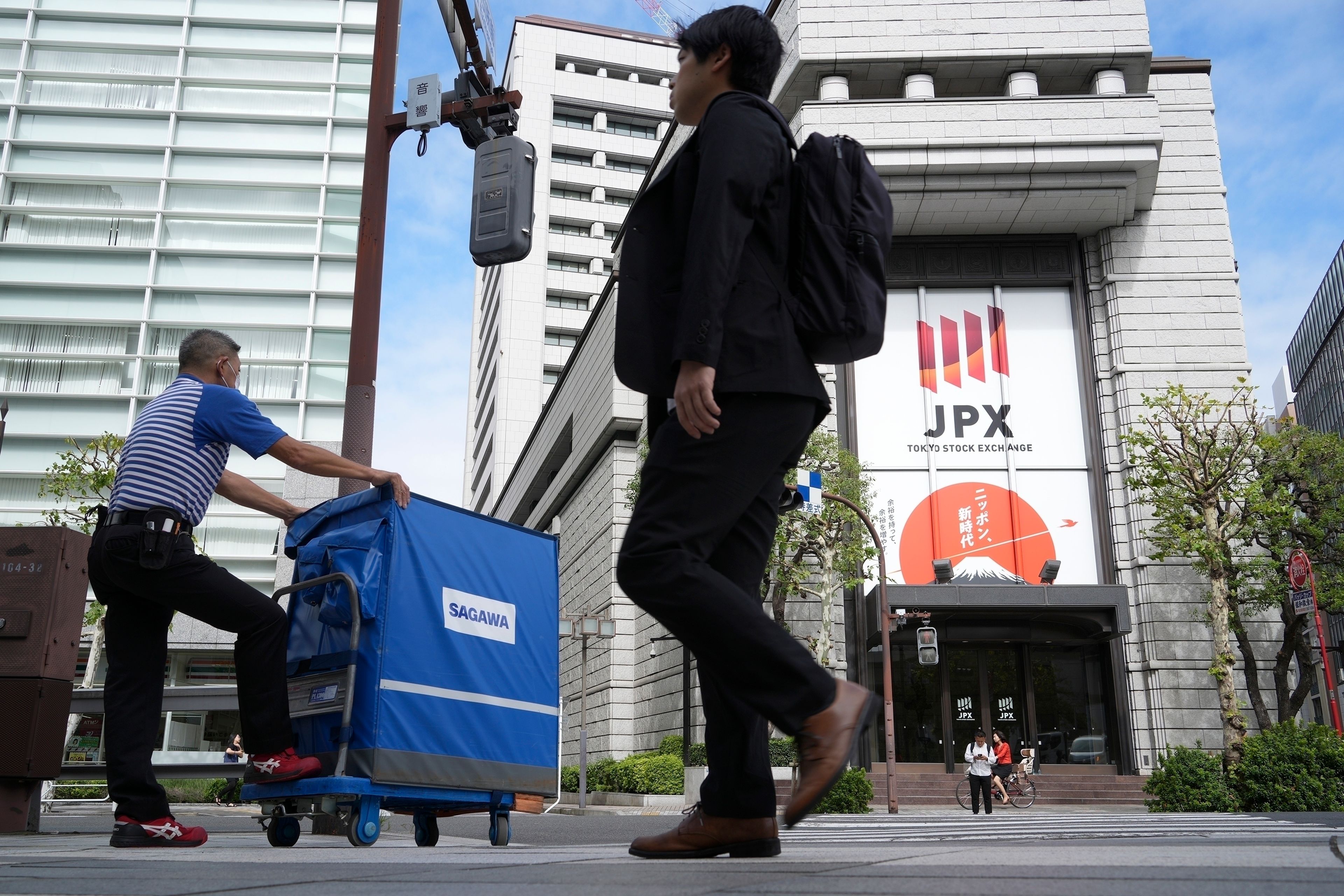 Asian markets mixed, Japanese stocks rally from Monday's slump