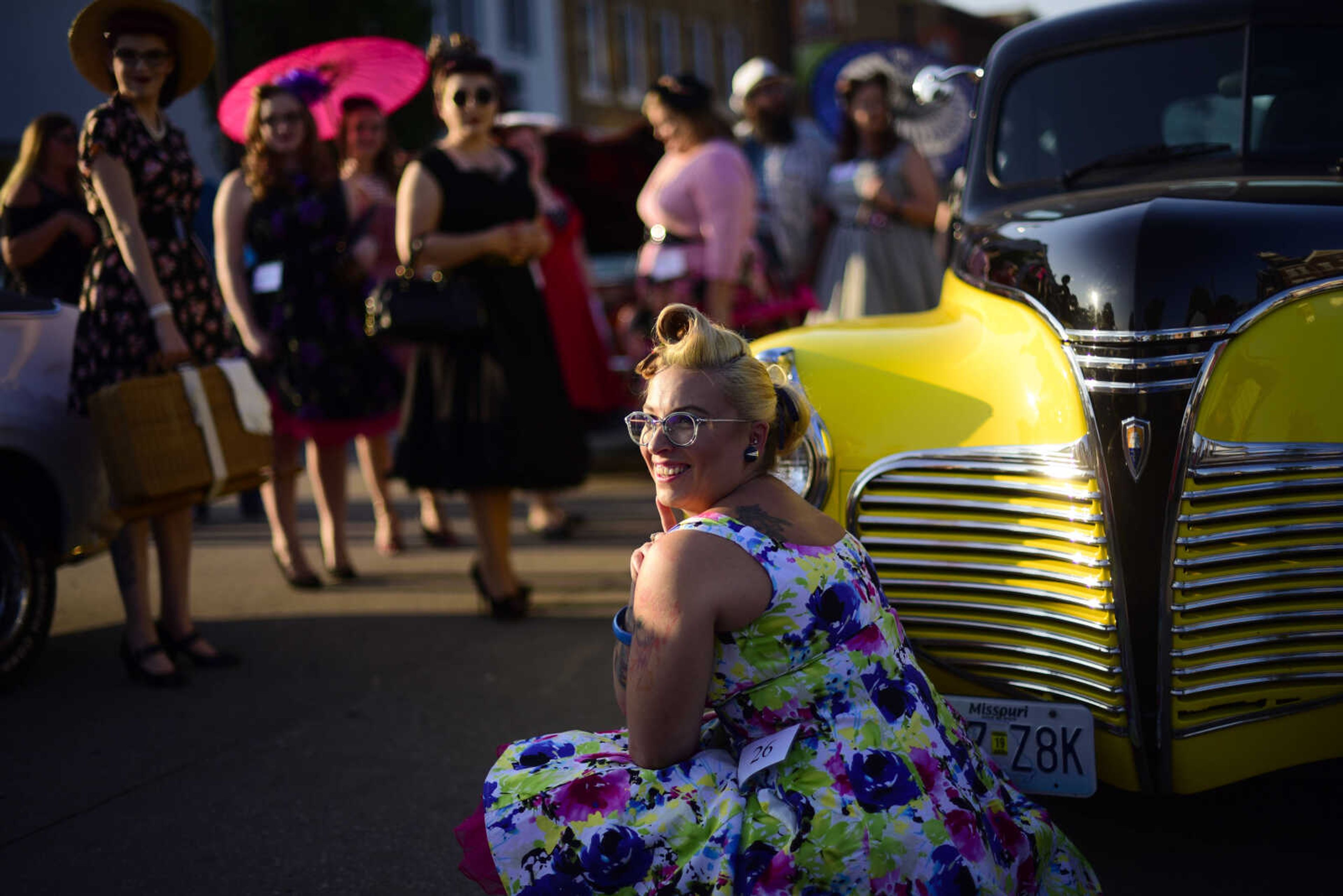 Natasha Scherrer with a Pinup name Miss Lola Sparkle poses by a vintage car during the Perryville Pinup contest Saturday, Sept. 2, 2017 in downtown Perryville.