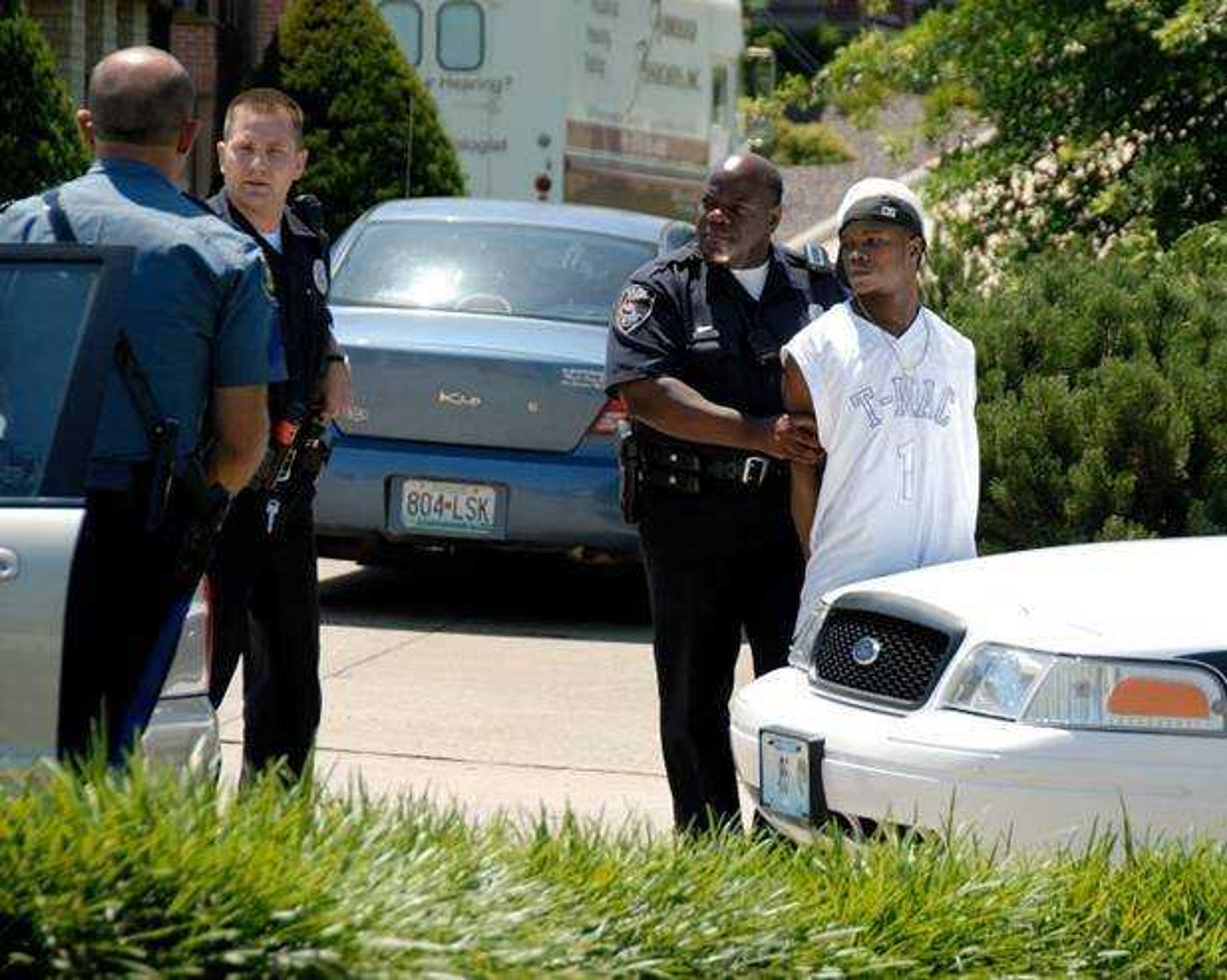 Cape Girardeau police arrest the suspected driver of a getaway car Tuesday following a shooting incident in the 2800 block of Themis St. The victim of the shooting was being treated at Saint Francis Medical Center for non-life threatening injuries. (Submitted photo -- Duncan Phenix.)