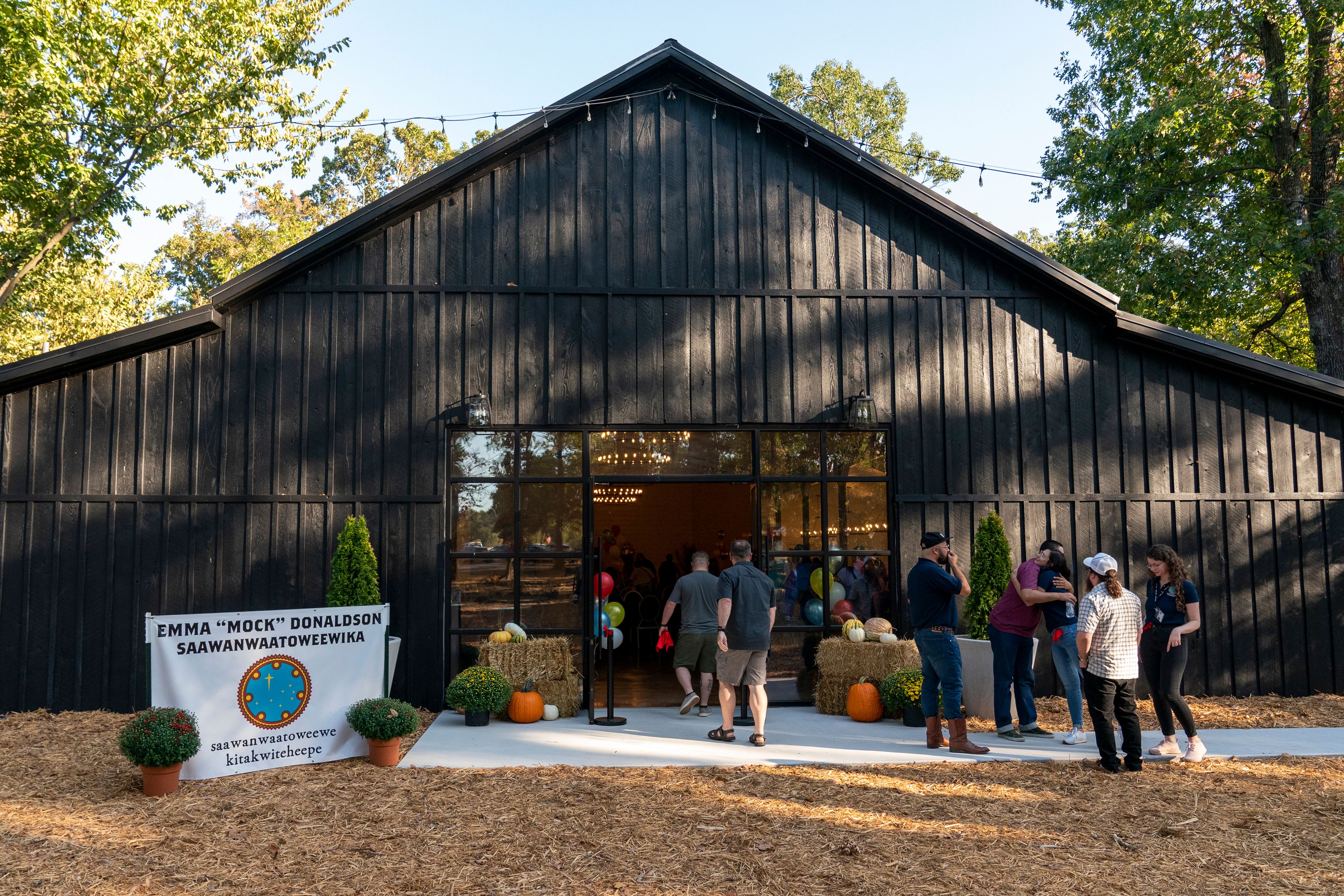 Community members enter the Shawnee Language Center on Friday, September 20, 2024 in Miami, Okla.. (AP Photo/Nick Oxford)