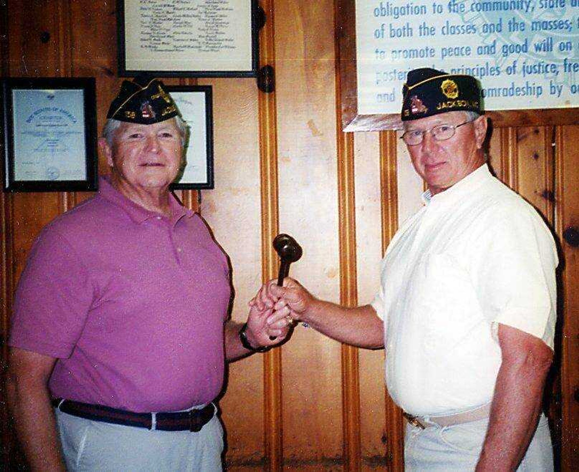 Bill Adams, American Legion 158 Post commander, left, passes command to Post 158 member, Lawson Burgfield as the newly elected 2010-2011 commander of the post. (Submitted photo)