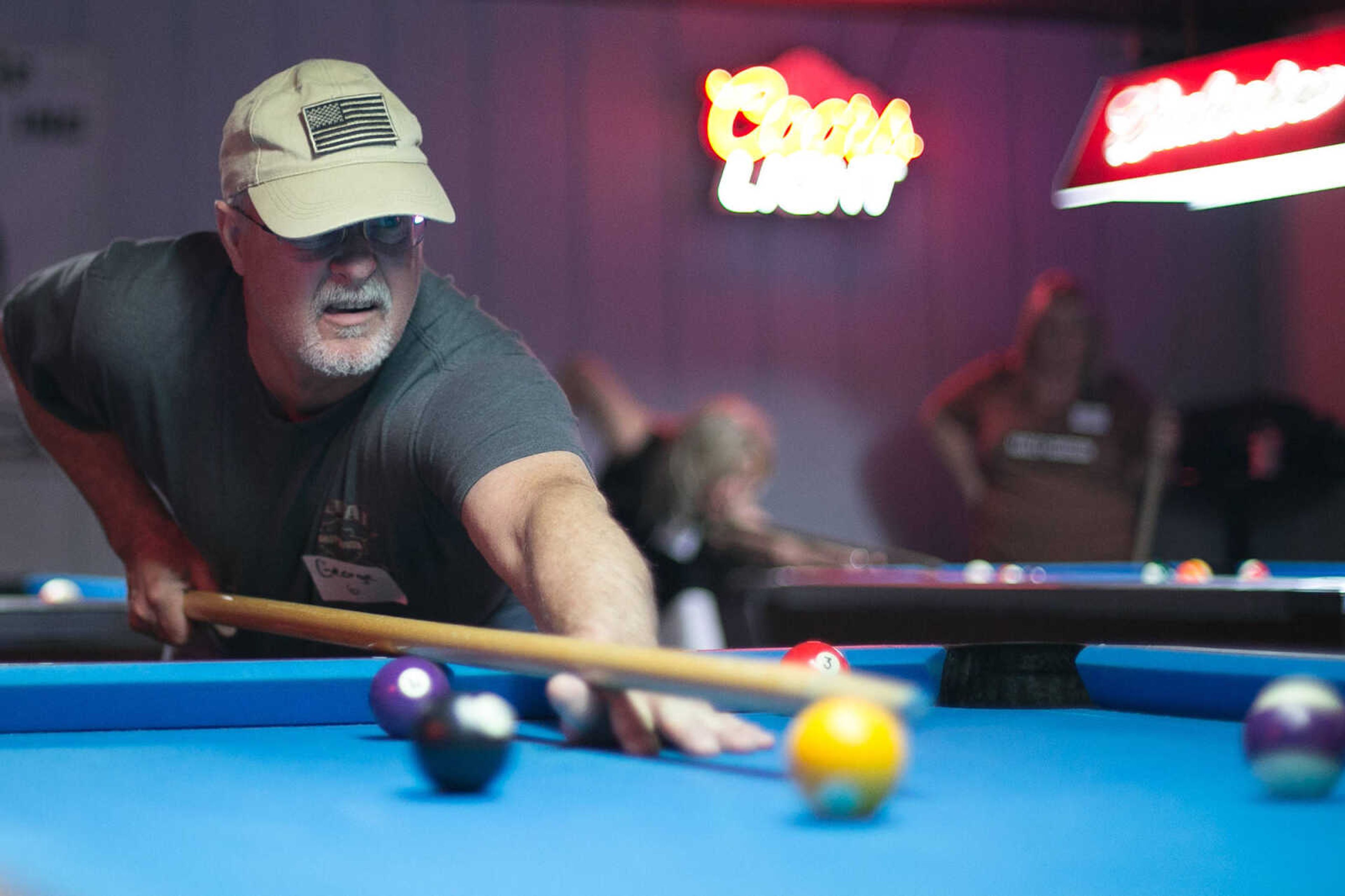 GLENN LANDBERG ~ glandberg@semissourian.com

George Reutzel looks to sink a ball during the annual broomstick pool tournament Saturday, Feb. 27, 2016 at JR's Bar & Billiards in Cape Girardeau. The tournament was sponsored by Local 16 SEMO, Freedom of Road Riders Inc.