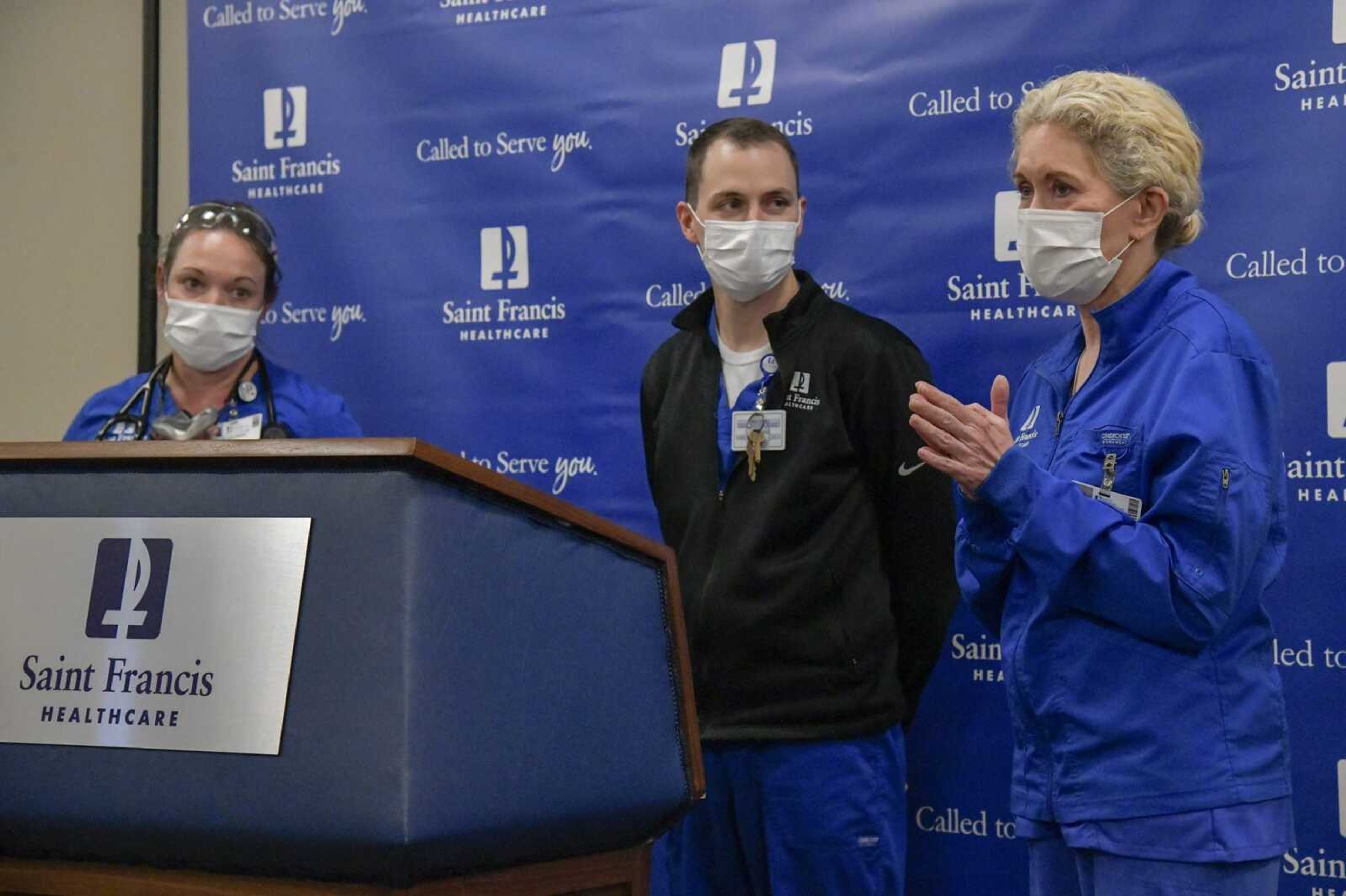 Physician Gretchen Price, left, clinical pharmacy specialist Stuart Greaser, middle, and president and CEO Maryann Reese -- working as a nurse Thursday in an "all hands on deck" situation -- speak during Thursday's news conference about COVID-19 care at Saint Francis Medical Center in Cape Girardeau.