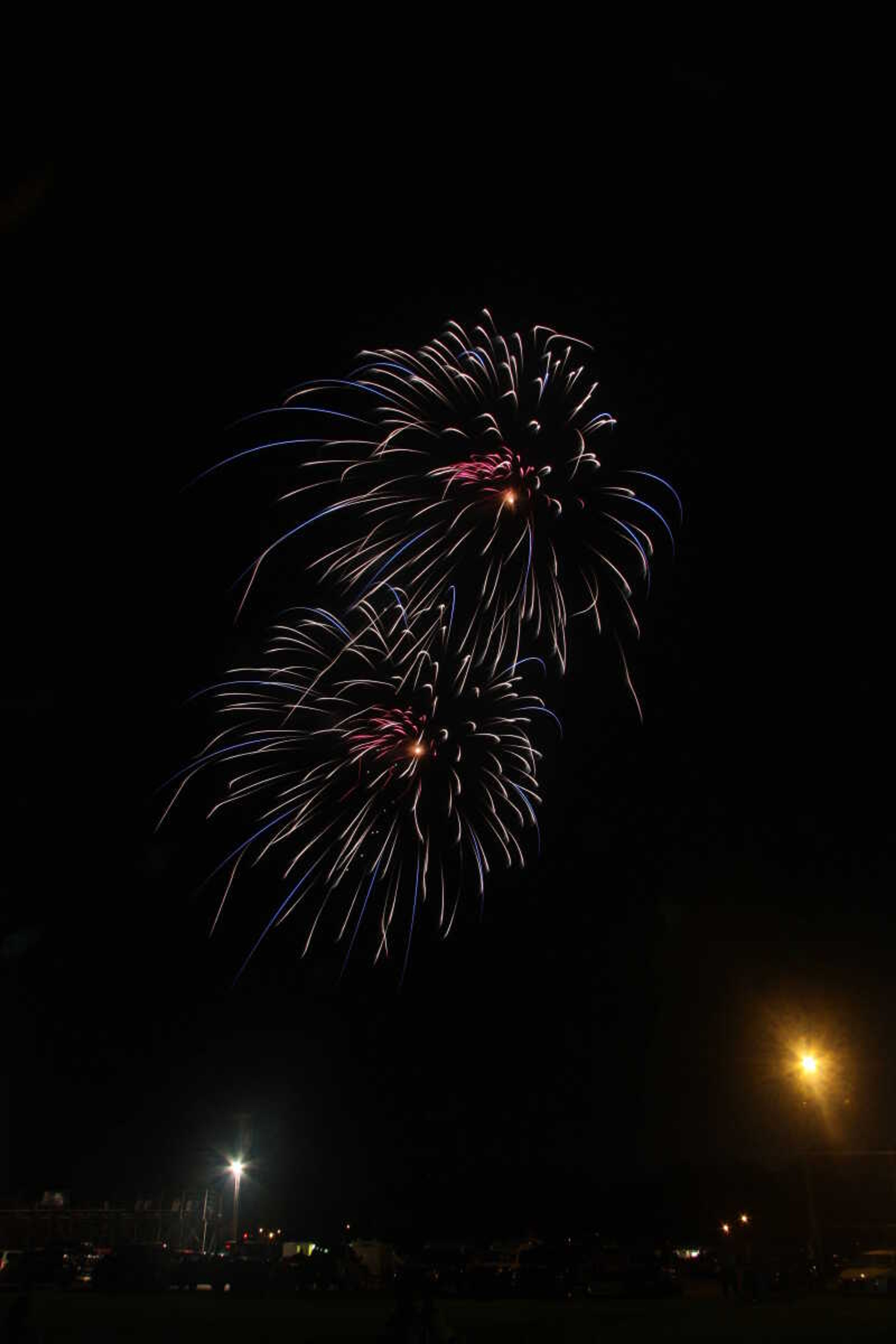 Picture of the fireworks display in Cape Girardeau's Arena Park, taken from a field south of the park.