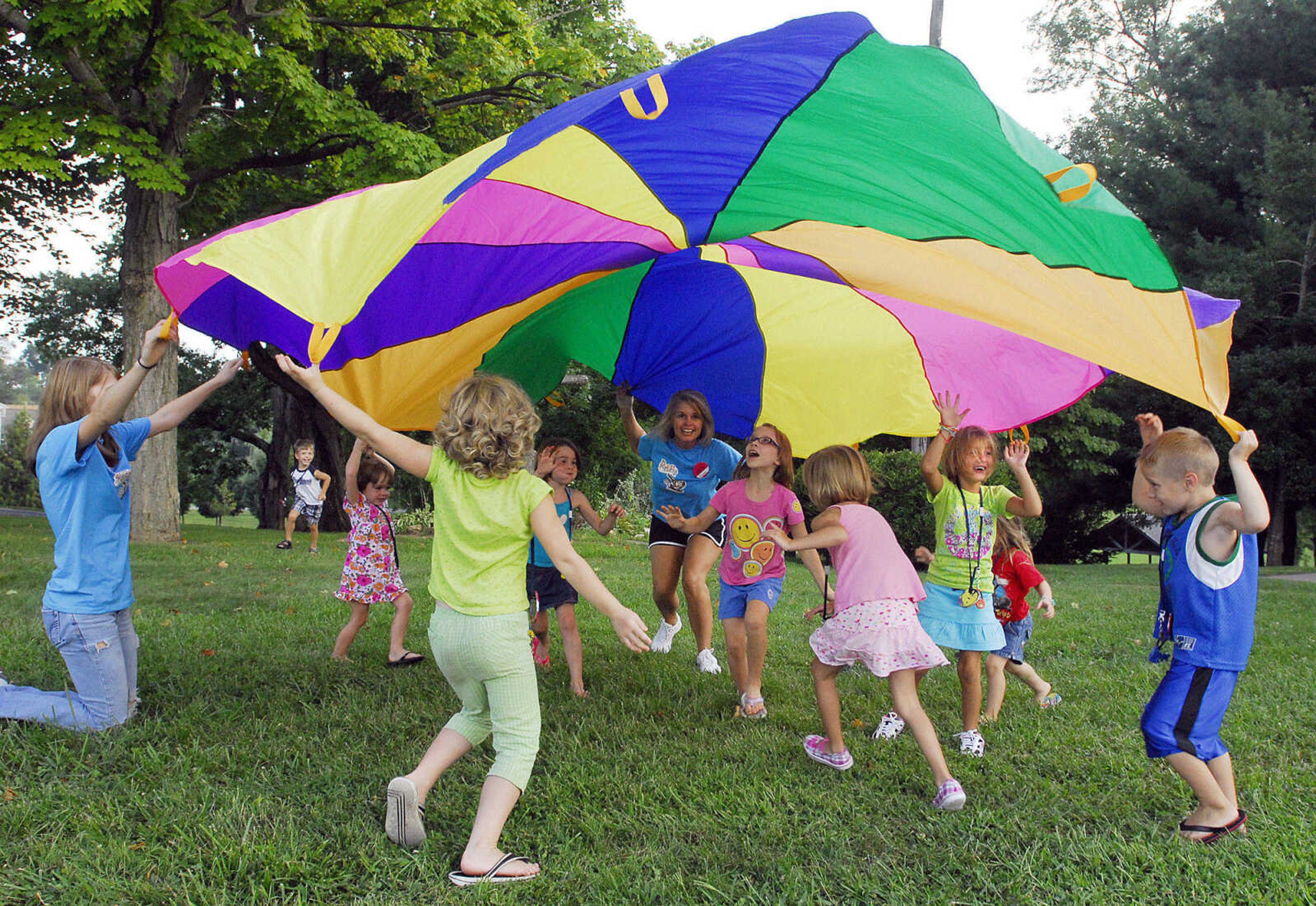 LAURA SIMON~lsimon@semissourian.com
Children attending VBS at Eisleben Lutheran Church in Scott City play under a parachute Monday, August 2, 2010.