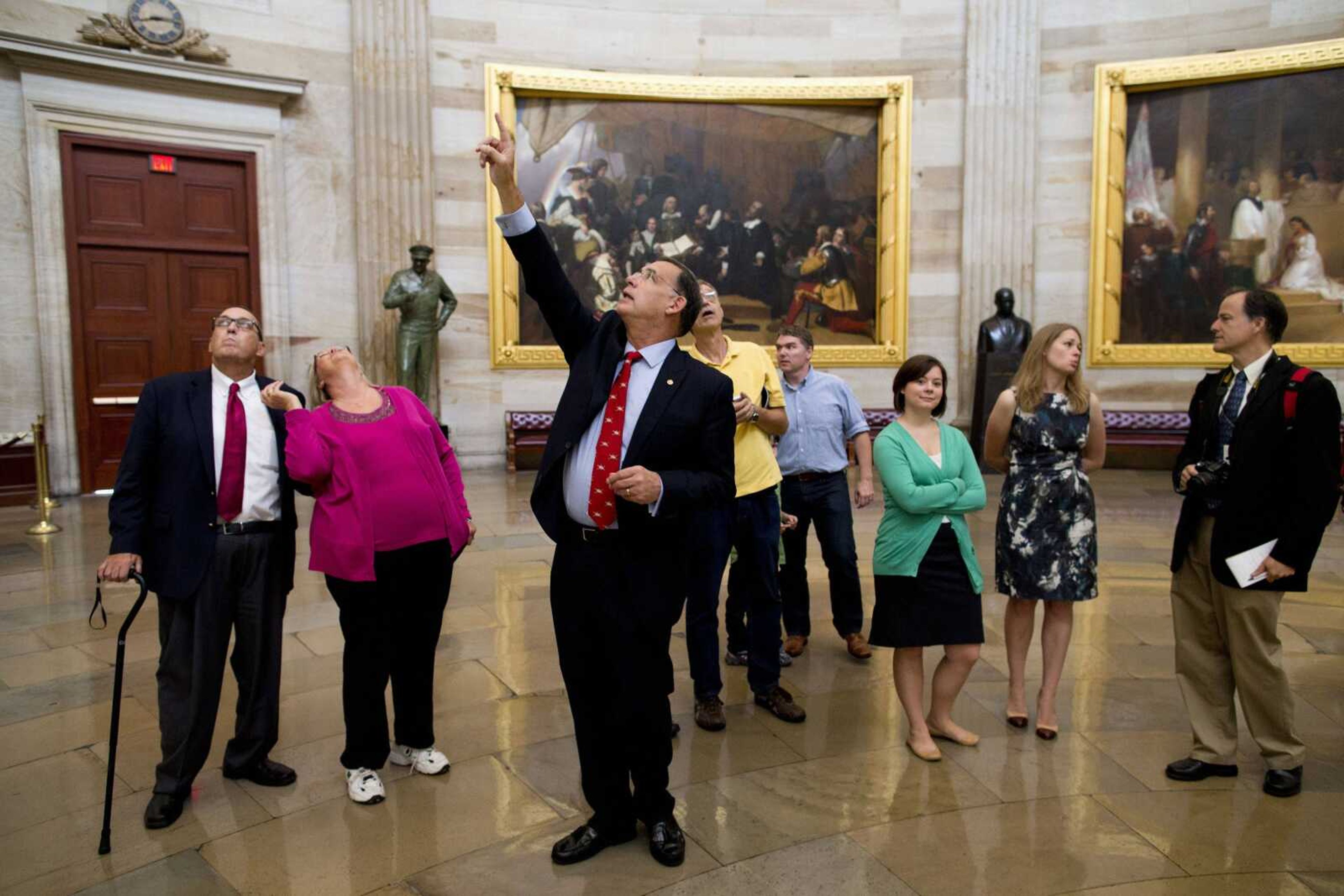 Sen. John Boozman, R-Ark., leads a tour Thursday in the Rotunda on Capitol Hill in Washington. Congressional staffers and interns usually lead constituent tours, but due to the federal government shutdown members of Congress have begun to lead tour groups from their home states. (Evan Vucci ~ Associated Press)