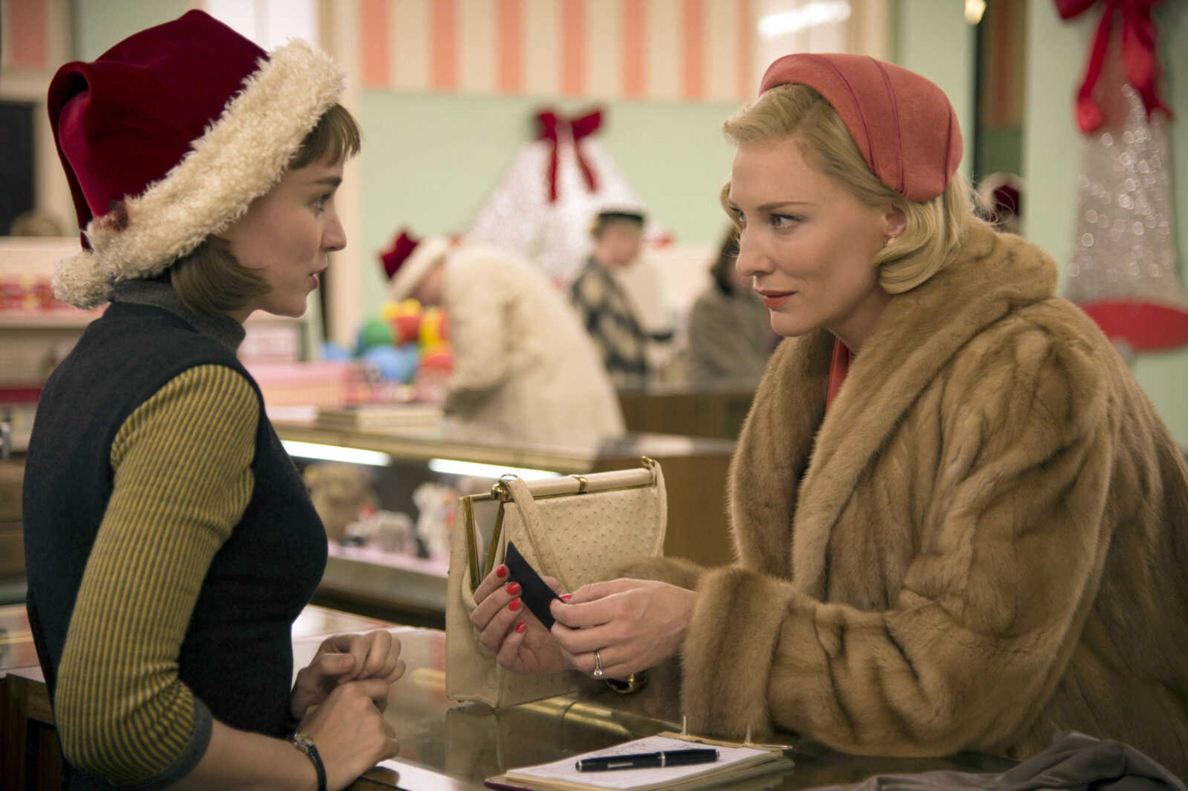 Rooney Mara, left, as Therese Belivet, and Cate Blanchett, as Carol Aird, are in a scene from the film, "Carol." The film has five Golden Globe nominations, including for best motion picture drama and Mara and Blanchett for best actress in a drama film. (Wilson Webb ~ The Weinstein Company via AP)