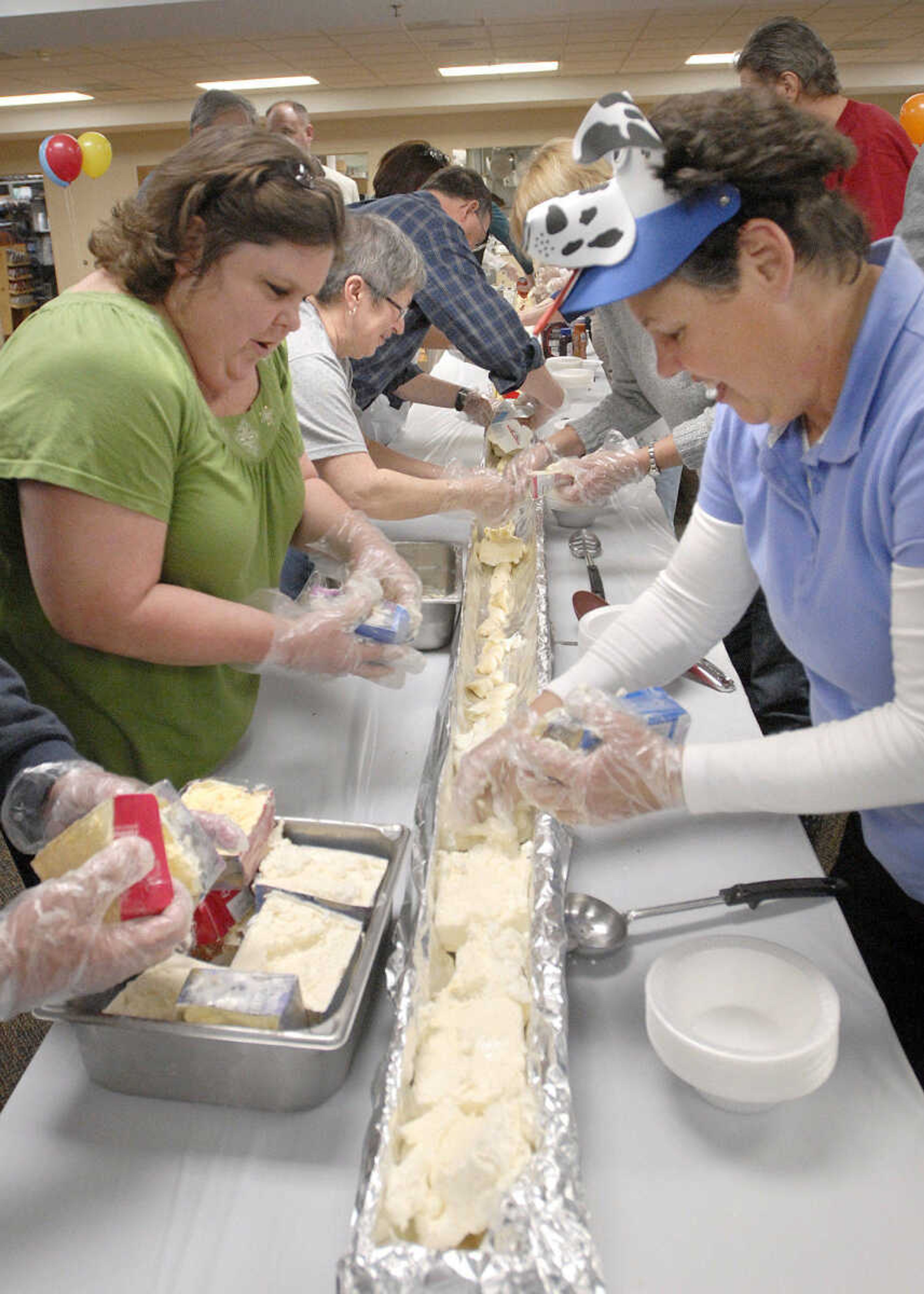 LAURA SIMON ~ lsimon@semissourian.com
Volunteers assemble the 30-foot long banana split Wednesday afternoon, January 25, 2012 at Lynwood Baptist Church in Cape Girardeau.