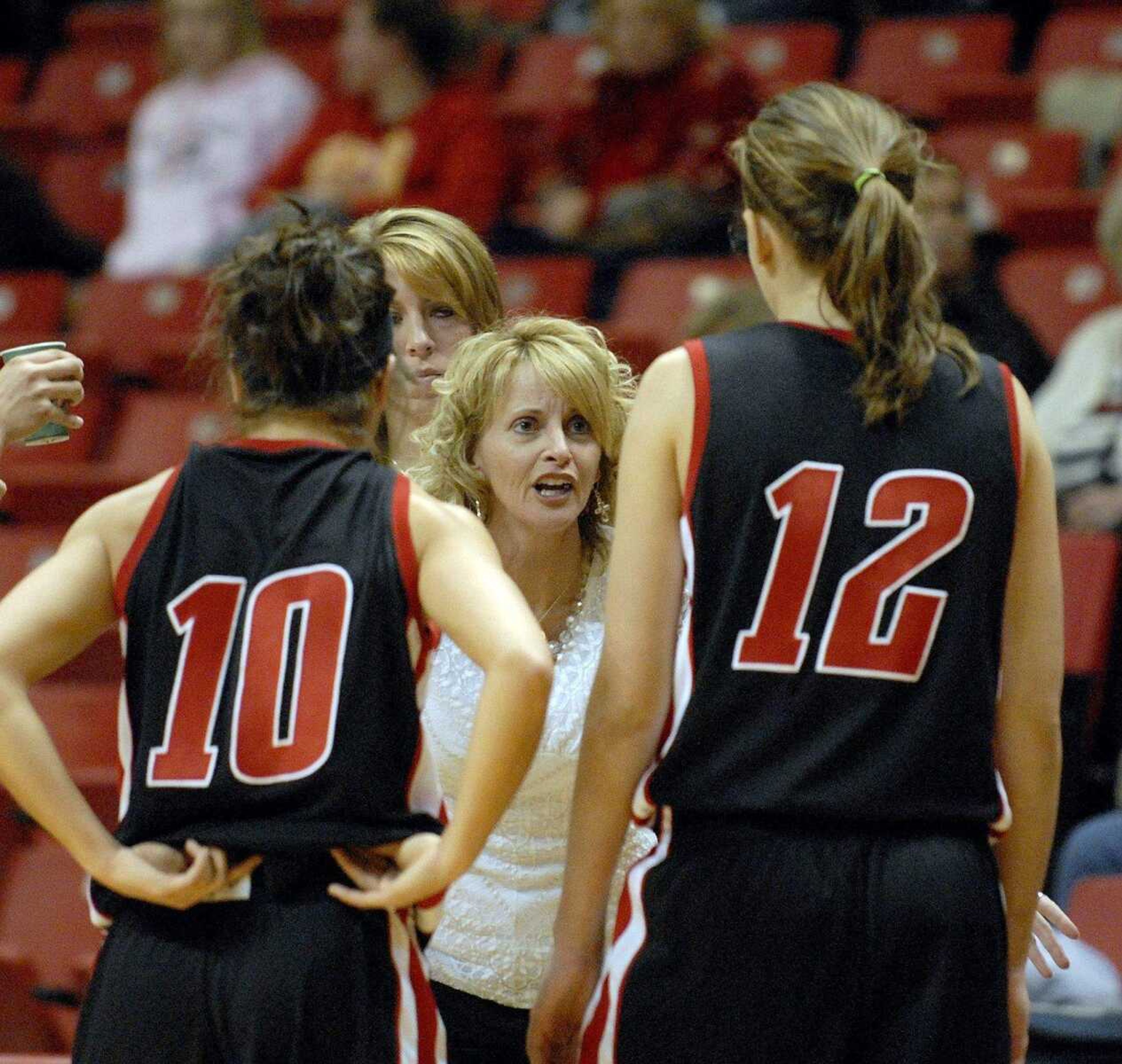 ELIZABETH DODD ~ edodd@semissourian.com
Jackson coach Shelia Midgett-Haertling gives pointers during a timeout in the second half against Sparta in the Holiday Classic.