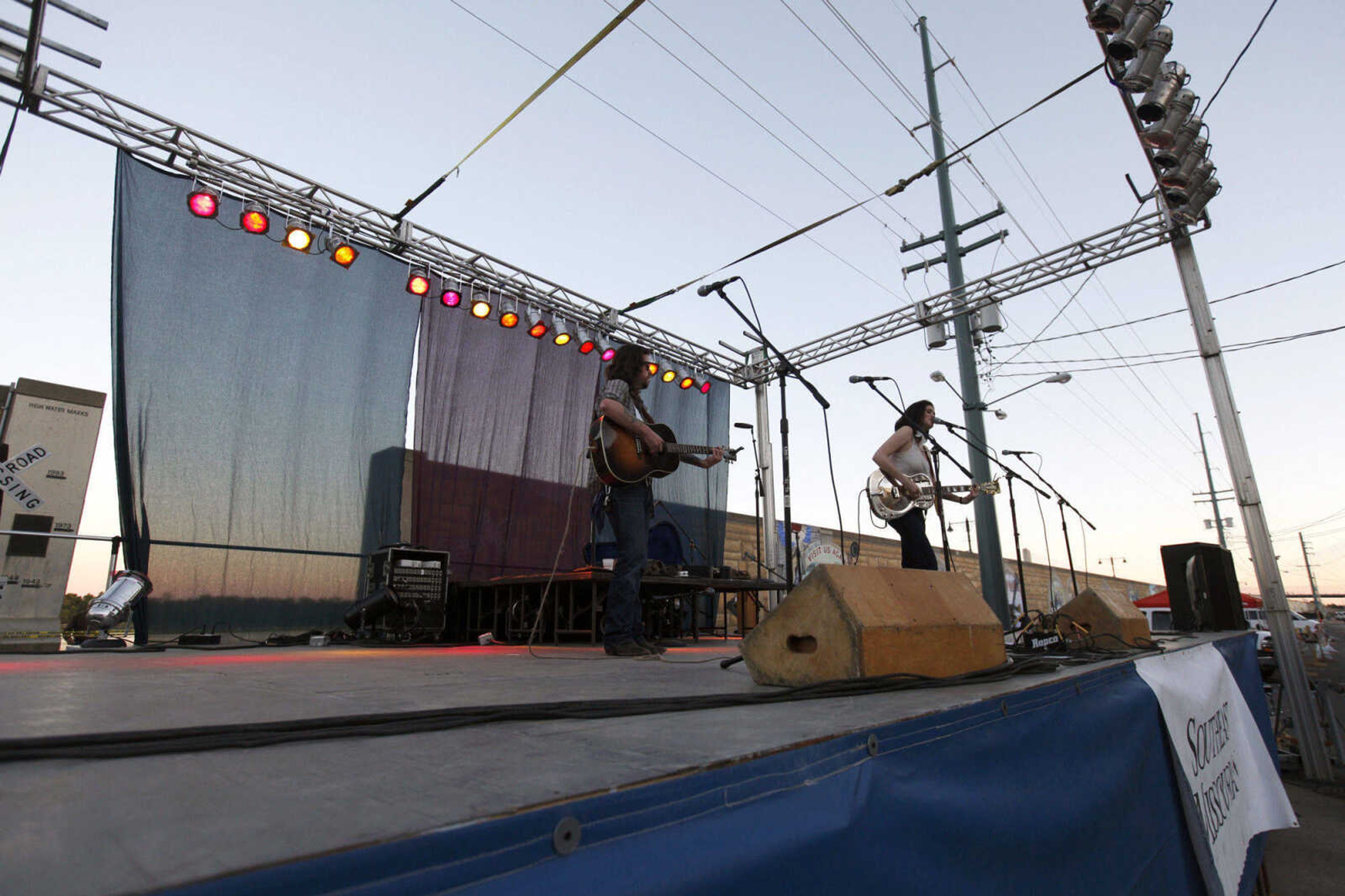 CHRIS MACKLER ~ photos@semissourian.com

Jeremy Stanfill (left) and Grace Askew, both of Memphis, perform on the main stage at the 14th annual River City Music Festival held in downtown Cape Girardeau on Friday, Oct. 1, 2010.