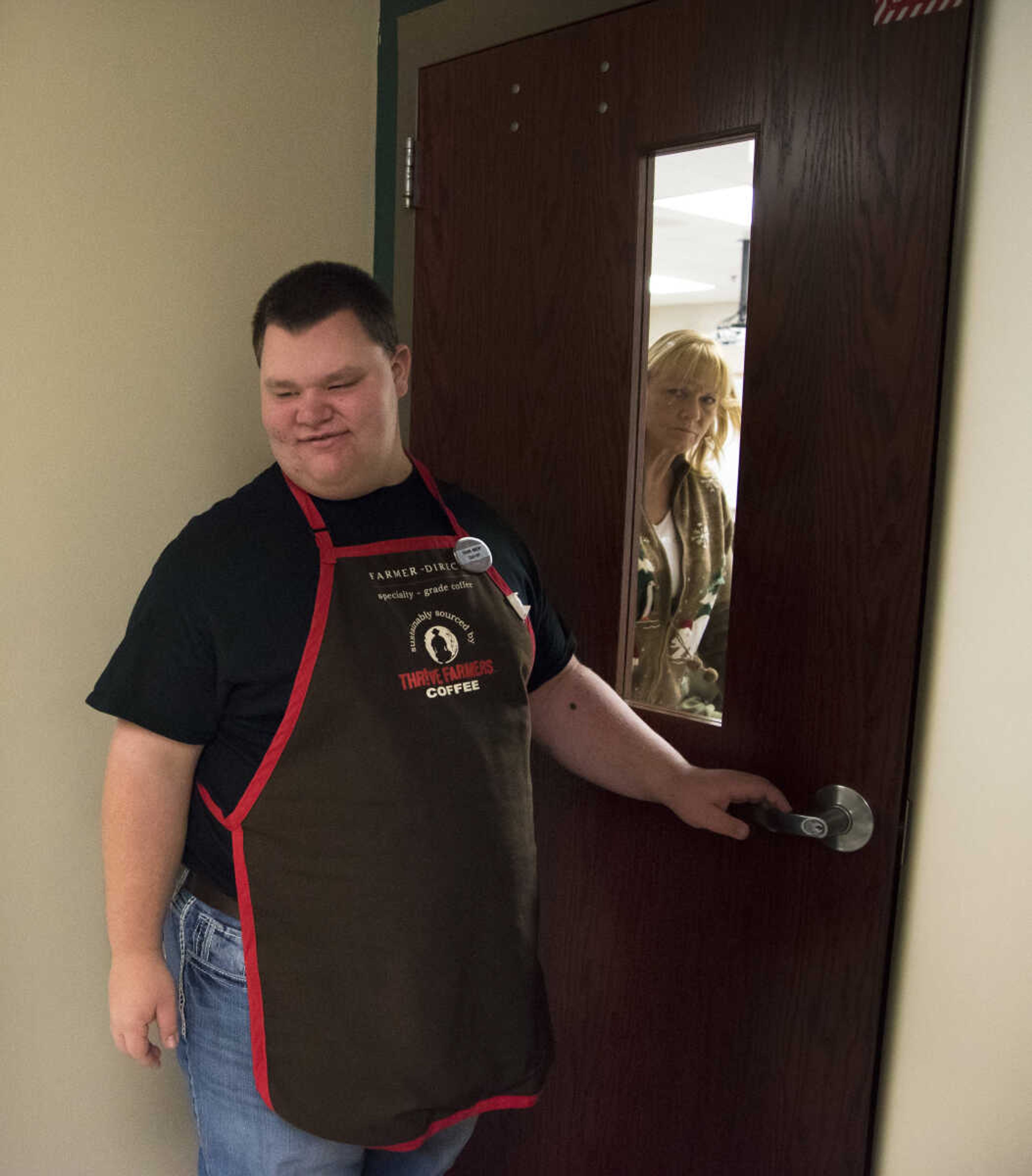 ANDREW J. WHITAKER ~ awhitaker@semissourian.com
Garrett Jones opens the door to deliver a drink to Jan Allen for Tiger Brew, a student run business run by the special education department at Cape Girardeau Central, Tuesday, Dec. 13, 2016 in Cape Girardeau. Tiger Brew is available Monday through Friday during three different class periods, 1st hour, 2nd hour and advisory and offer a variety of drinks from hot coffees and teas, iced drinks, hot chocolates and even smoothies.