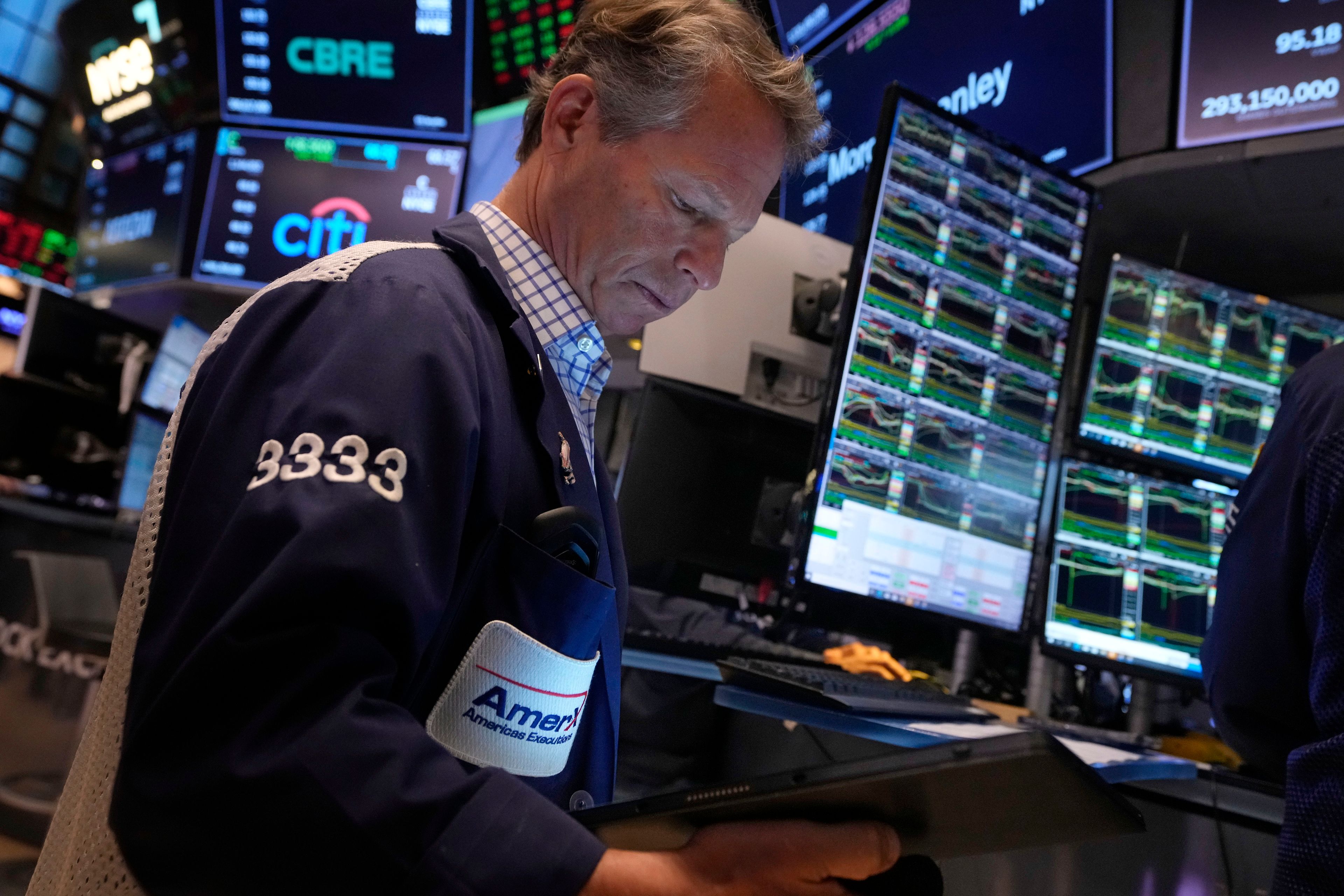 Trader Robert Charmak works on the floor of the New York Stock Exchange, Friday, Nov. 8, 2024. (AP Photo/Richard Drew)