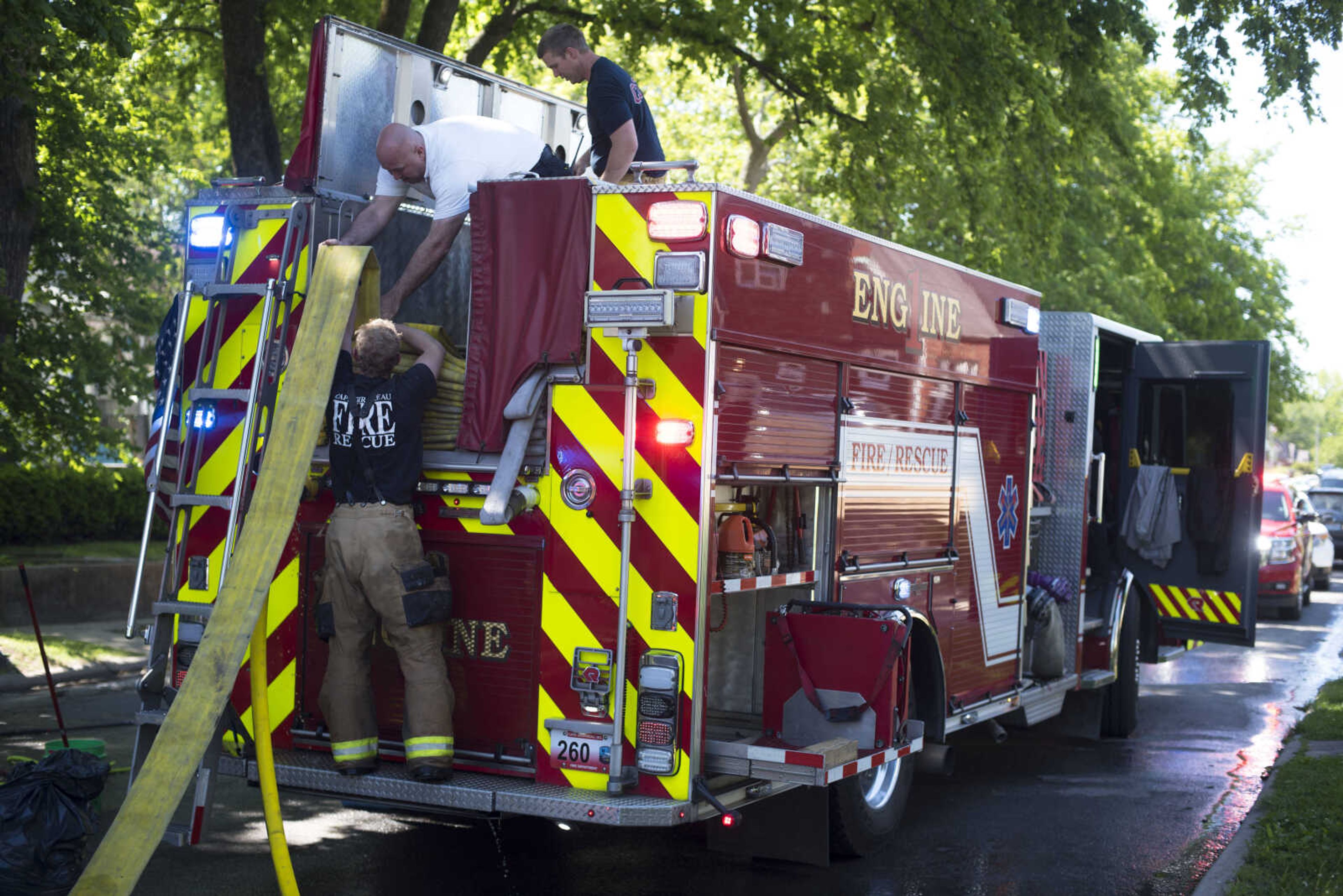 Members of the Cape Girardeau Fire Department respond to the scene of a structure fire Monday, May 11, 2020, at 40 North Henderson Ave. in Cape Girardeau.