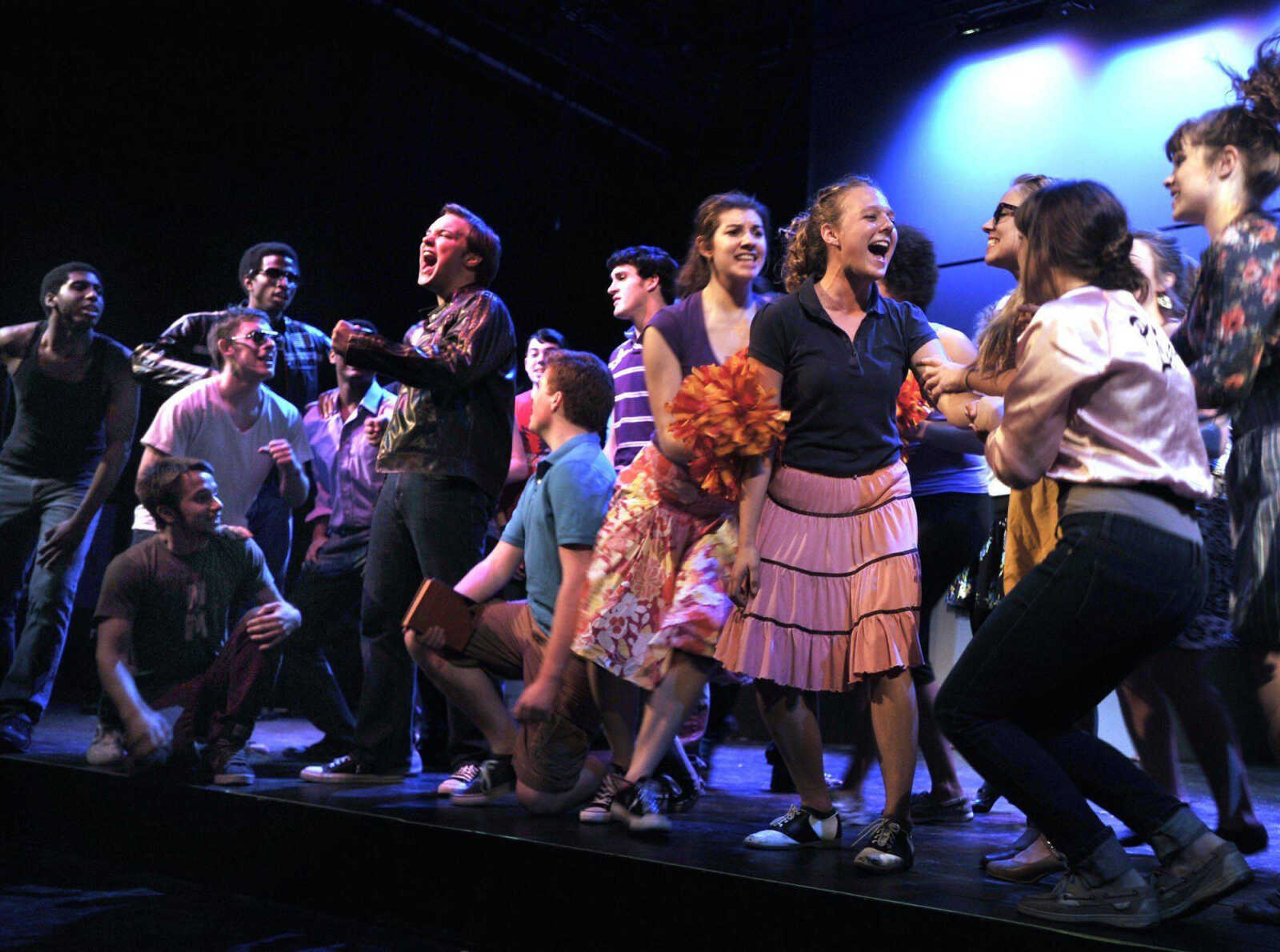 The cast of Grease sings "Summer Nights" with Danny, played by Michael Burrell, and Sandy, played by Stefanie Kluba, during a rehearsal Sept. 20, 2012 by Southeast Missouri State University students at the Bedell Performance Hall. (Fred Lynch)