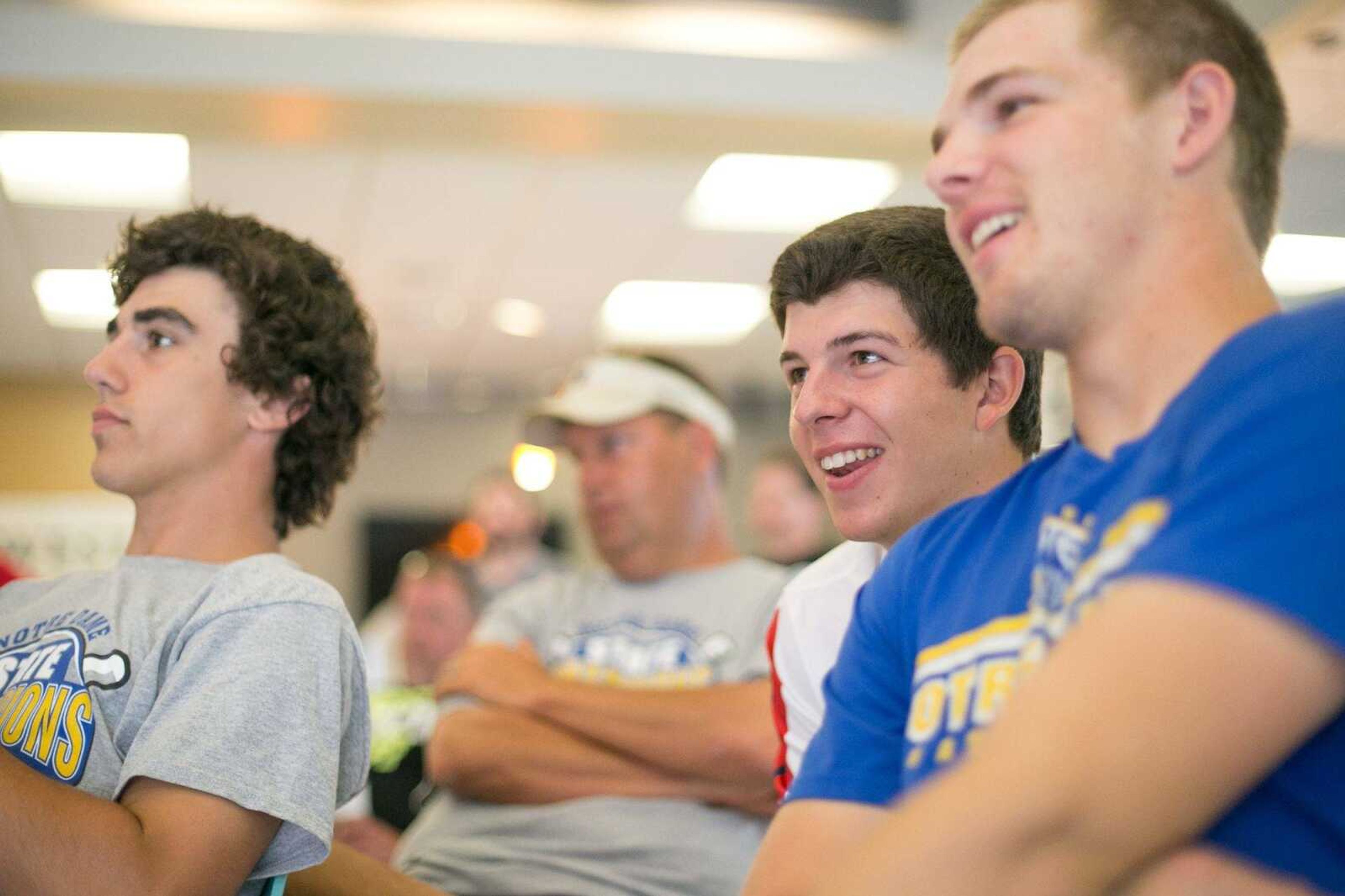 Notre Dame baseball players, Adam Pope, left, Chase Urhahn and Derek Hulshof watch the announcements for finalist during the Semoball Awards spring sports selection show at First Midwest Bank Saturday, June 13, 2015 in Cape Girardeau. (Glenn Landberg)