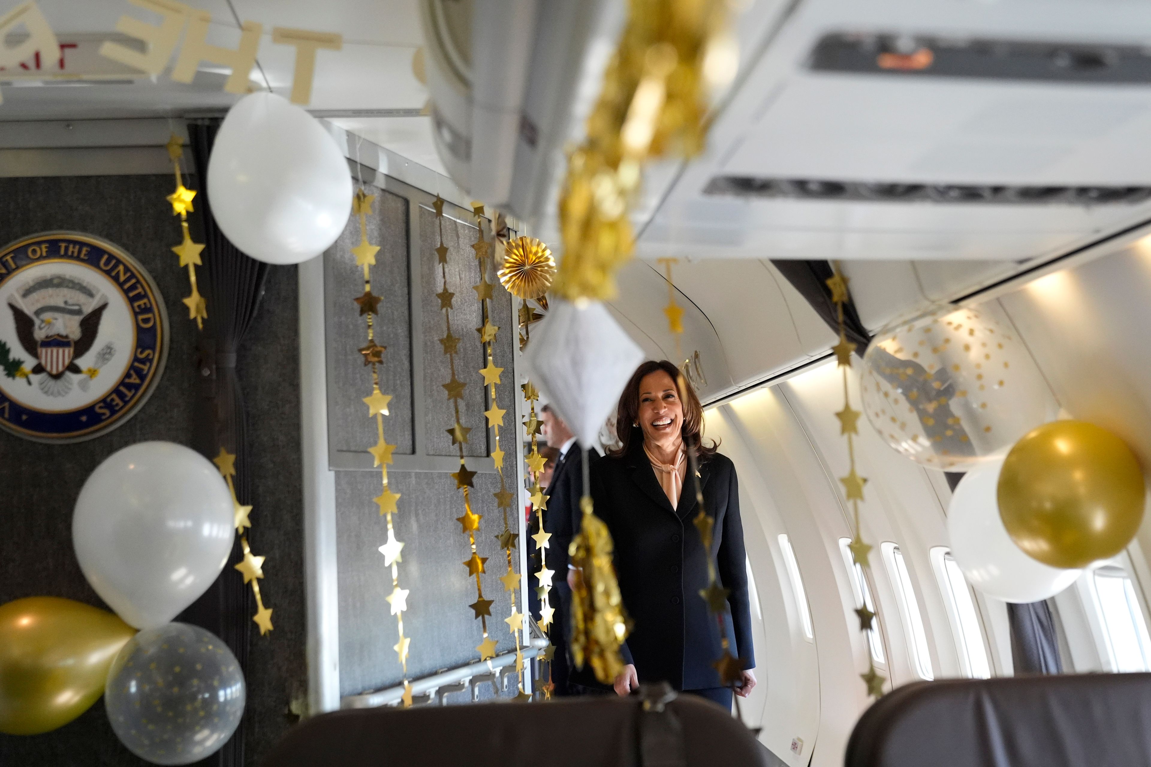 Democratic presidential nominee Vice President Kamala Harris is surprised by campaign staff with birthday decorations on Air Force Two before departing Hartsfield Jackson International Airport in Atlanta, Sunday, Oct. 20, 2024, en route to Philadelphia. (AP Photo/Jacquelyn, Martin, Pool)