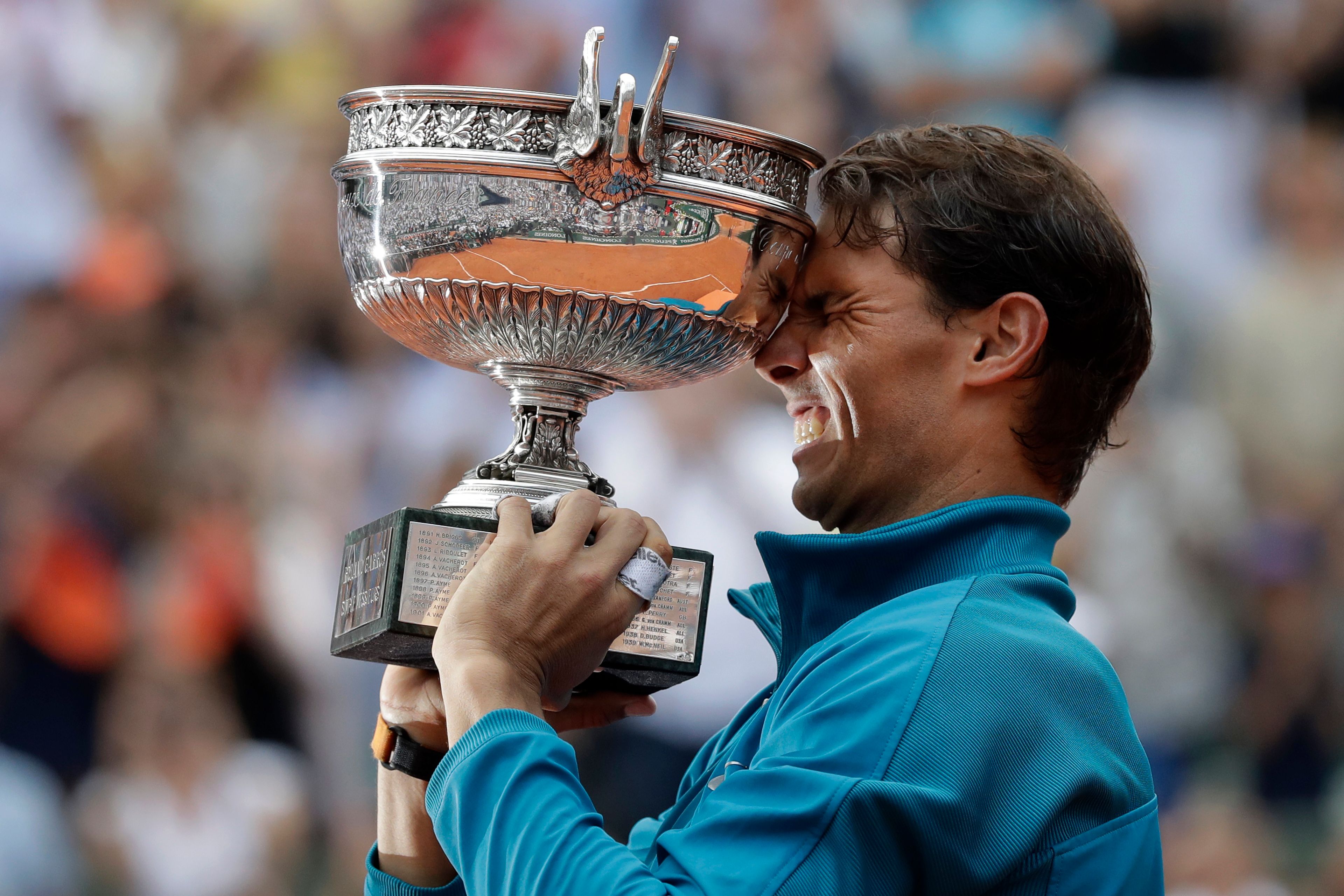 FILE - Spain's Rafael Nadal holds the trophy as he celebrates winning the men's final match of the French Open tennis tournament against Austria's Dominic Thiem at the Roland Garros stadium in Paris, France, Sunday, June 10, 2018. (AP Photo/Alessandra Tarantino, File)