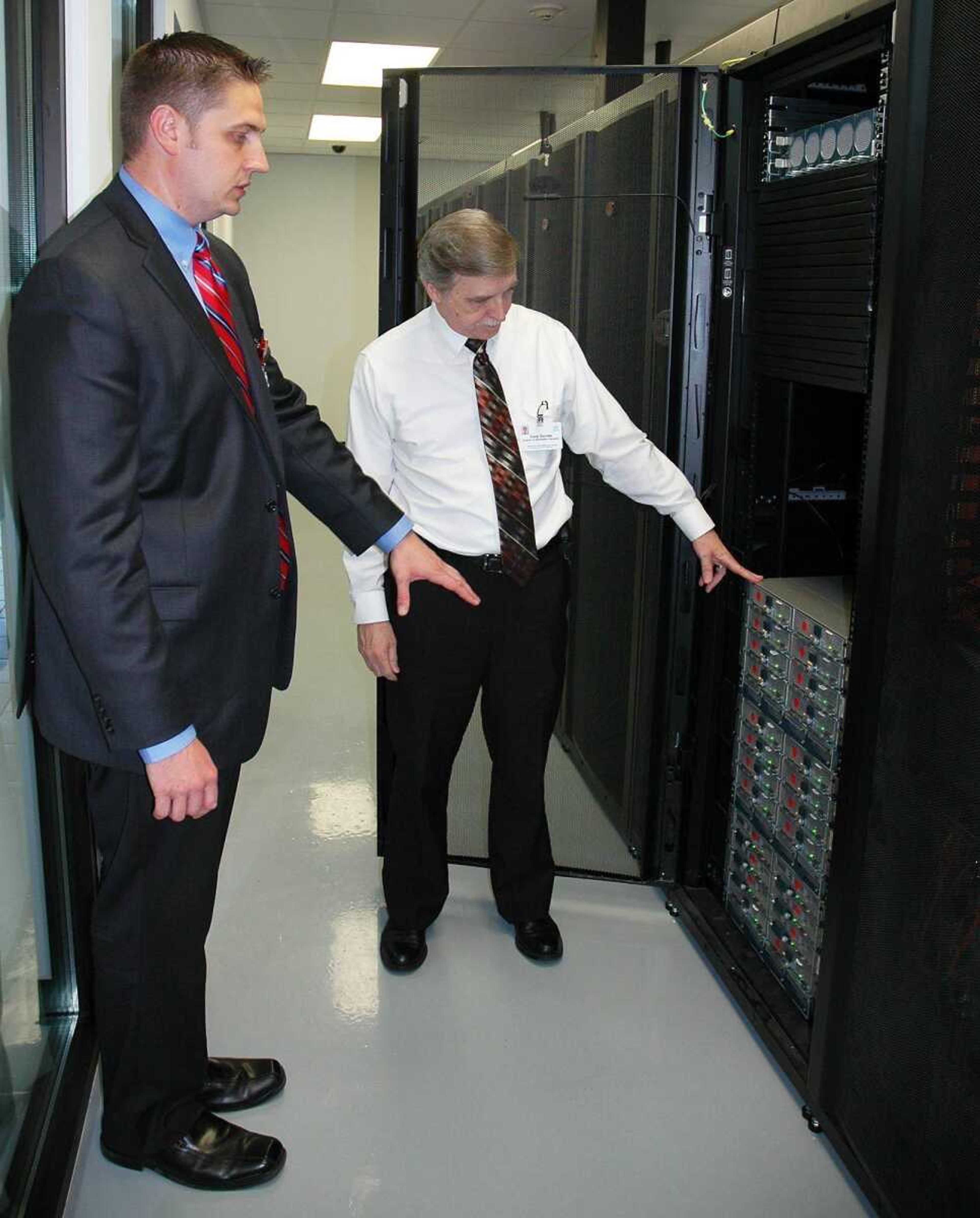 Mike Dozier, left, regional information officer at SoutheastHEALTH, and Gary Gaines, director of information services at Missouri Delta Medical Center in Sikeston, Mo., show the server towers that store electronic medical records during an open house in May. (File photo)