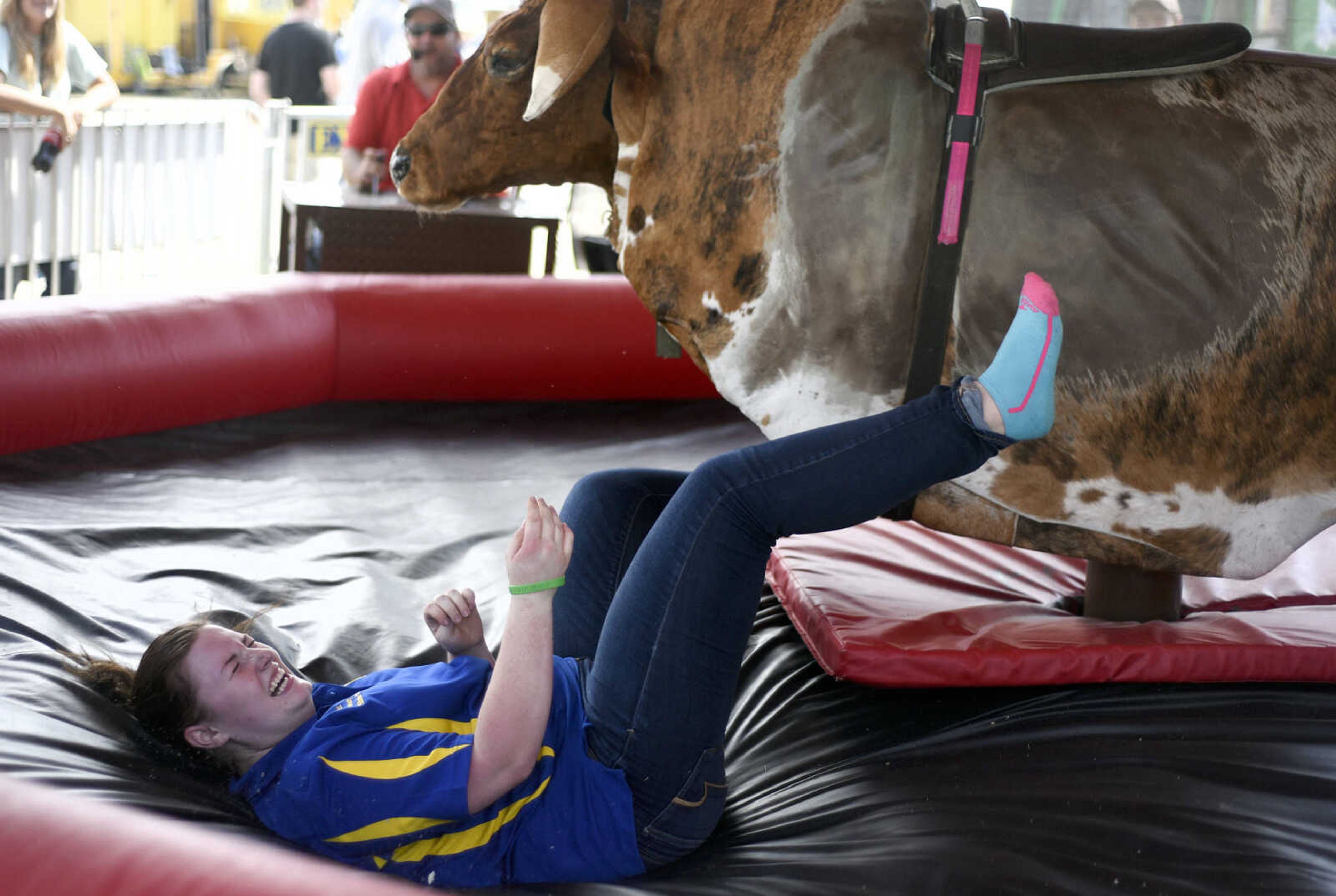 LAURA SIMON ~ lsimon@semissourian.com

People take a shot at the mechanical bull in the 8 Seconds Productions booth at the SEMO District Fair on Friday, Sept. 16, 2016, at Arena Park in Cape Girardeau.