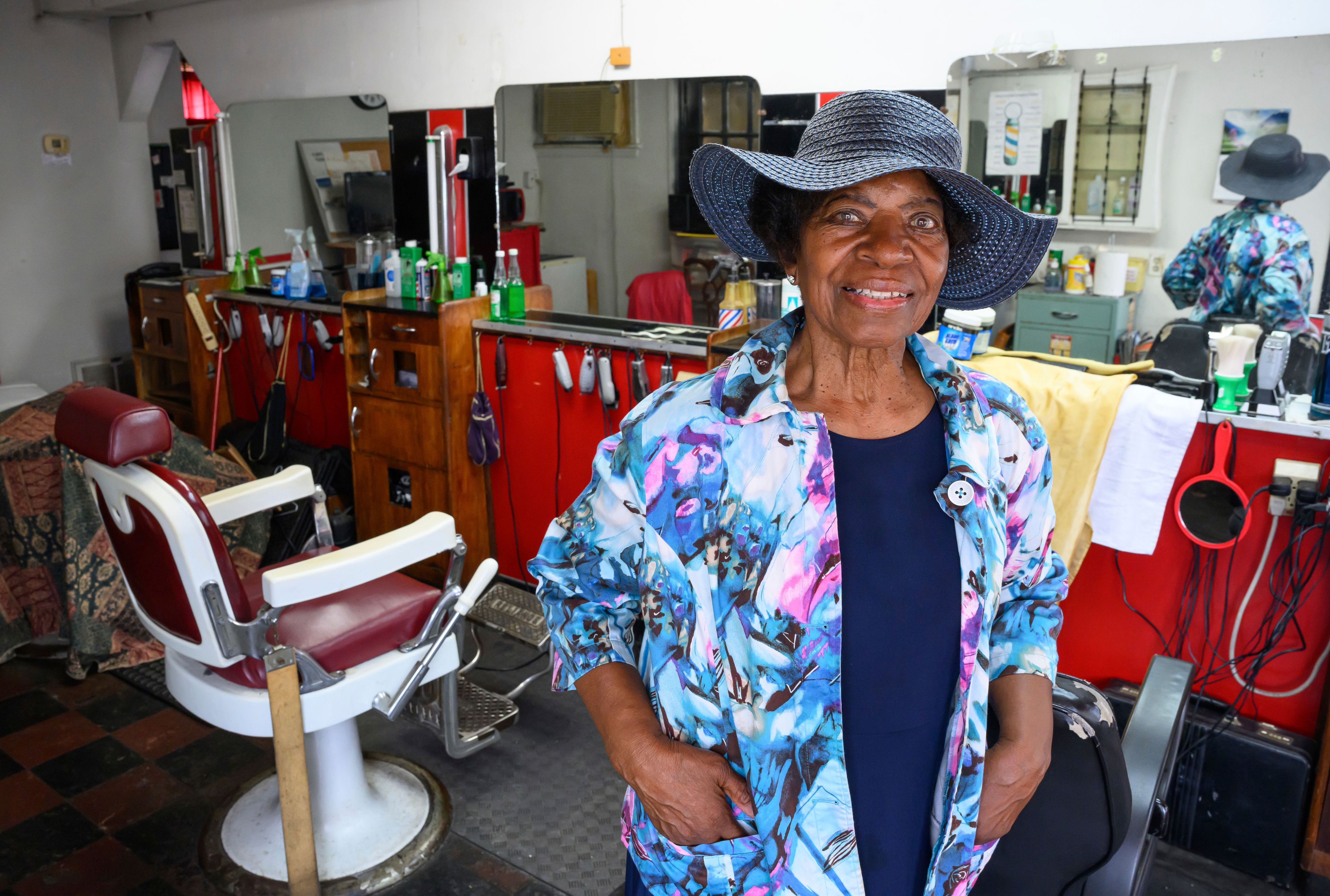 Courtney Speed, of Turner Station, Md., stands in Speed's Barber and Beauty, her salon, Sunday, Aug. 18, 2024, in Turner Station. Turner Station is located near the former site of the Francis Scott Key Bridge, which collapsed in March. (AP Photo/Steve Ruark)