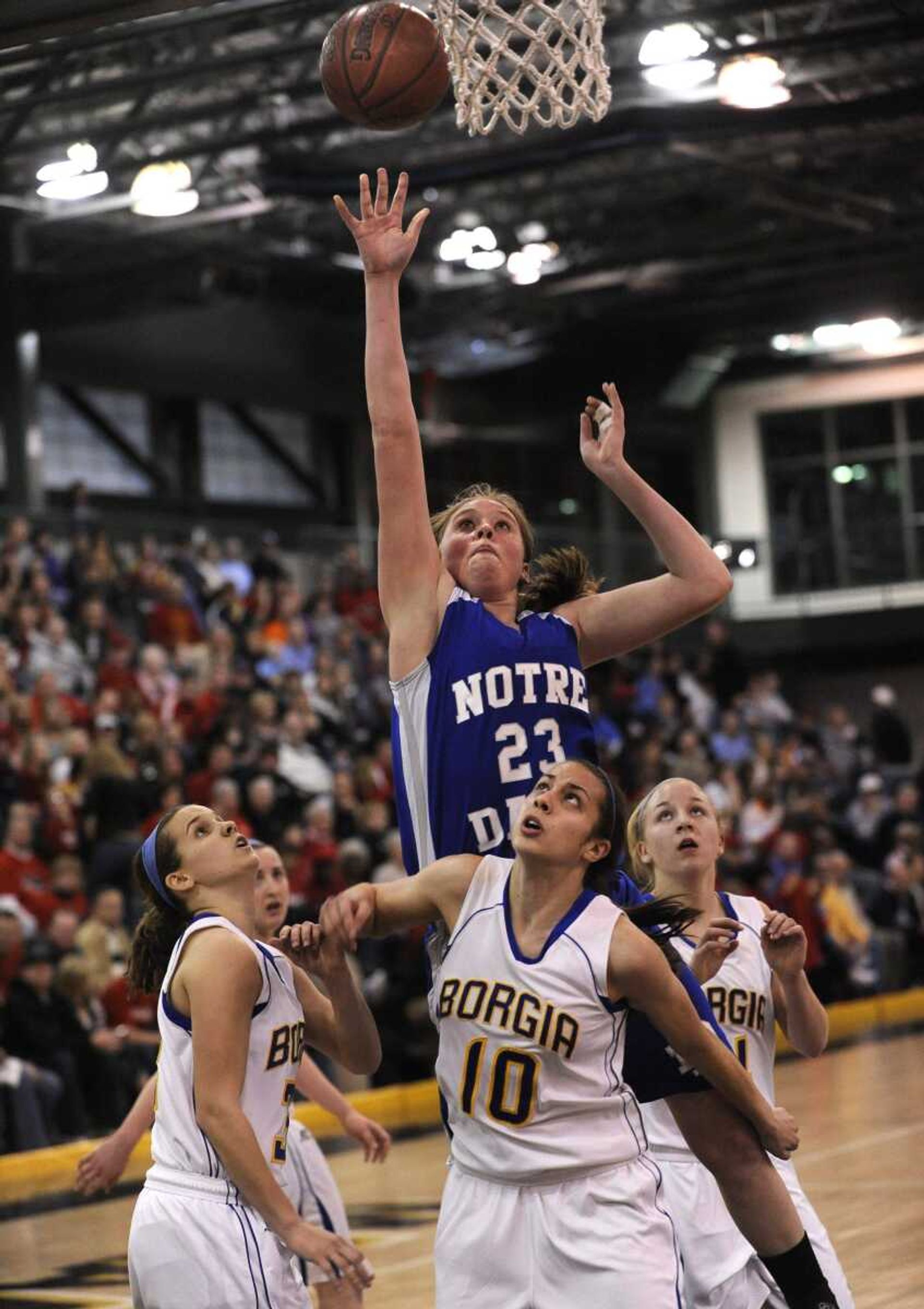 A key for Notre Dame at the final four will be steering clear of foul trouble. Senior center Jane Morrill, shown shooting in the quarterfinal win against Borgia, can be a dominant force inside, but she was saddled with gamelong foul problems against Farmington in the sectional round. (Fred Lynch)