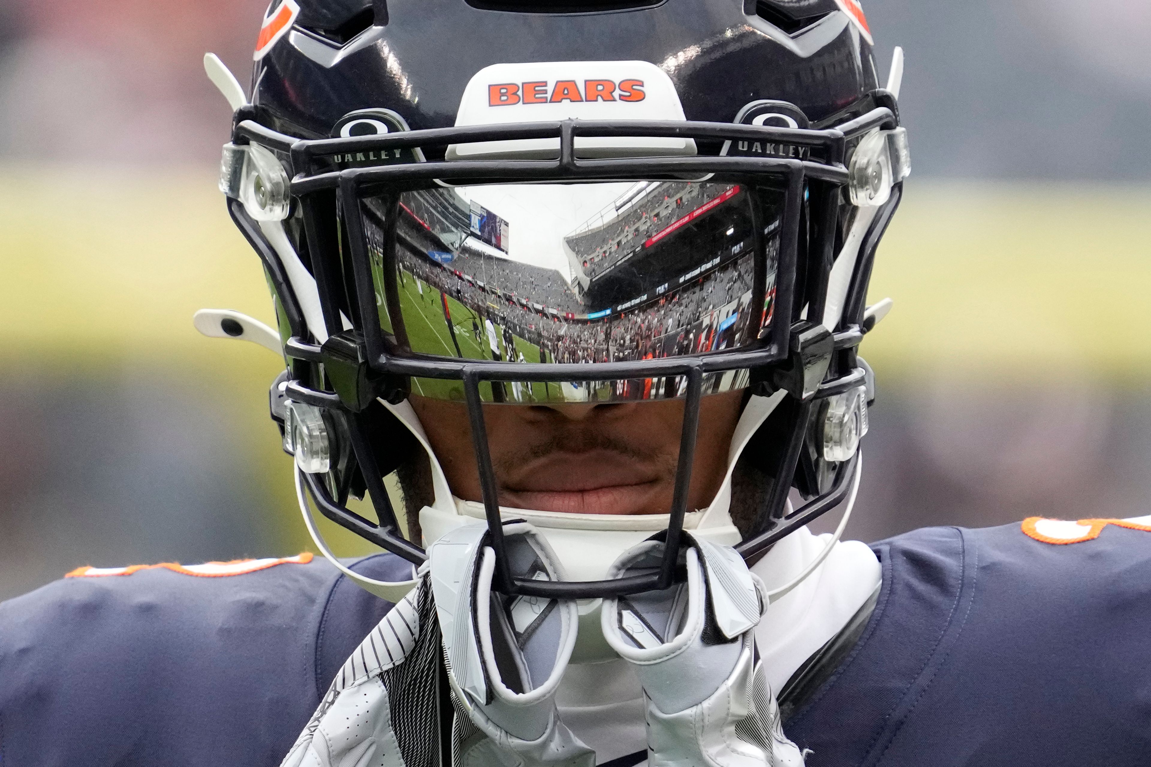 Soldier Field is reflected in the visor of Chicago Bears wide receiver DJ Moore before an NFL football game against the Los Angeles Rams on Sunday, Sept. 29, 2024, in Chicago. (AP Photo/Nam Y. Huh)