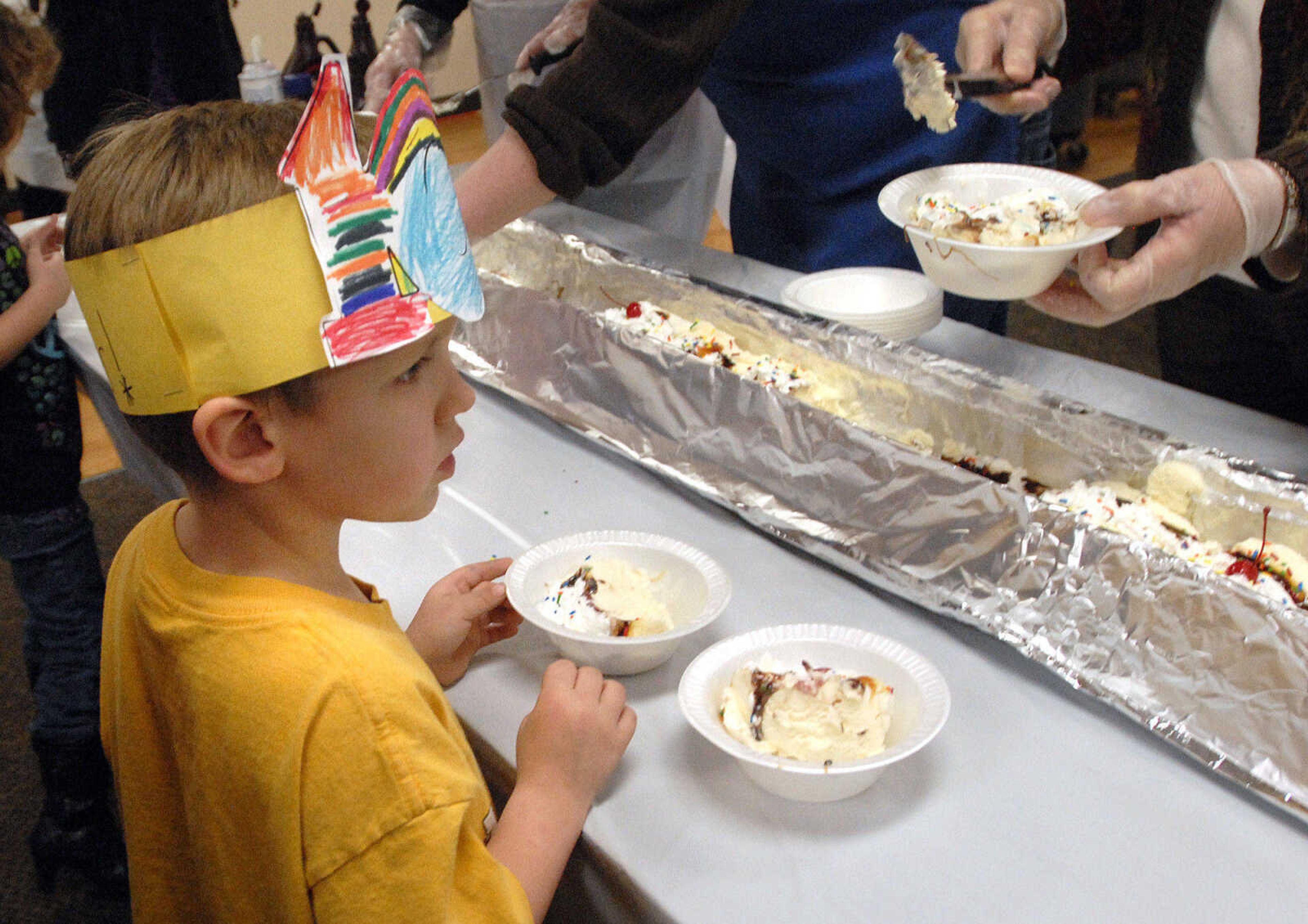 LAURA SIMON ~ lsimon@semissourian.com
Kyle Dodd gets in line for a bowl of the banana split Wednesday afternoon, January 25, 2012 at Lynwood Baptist Church in Cape Girardeau.