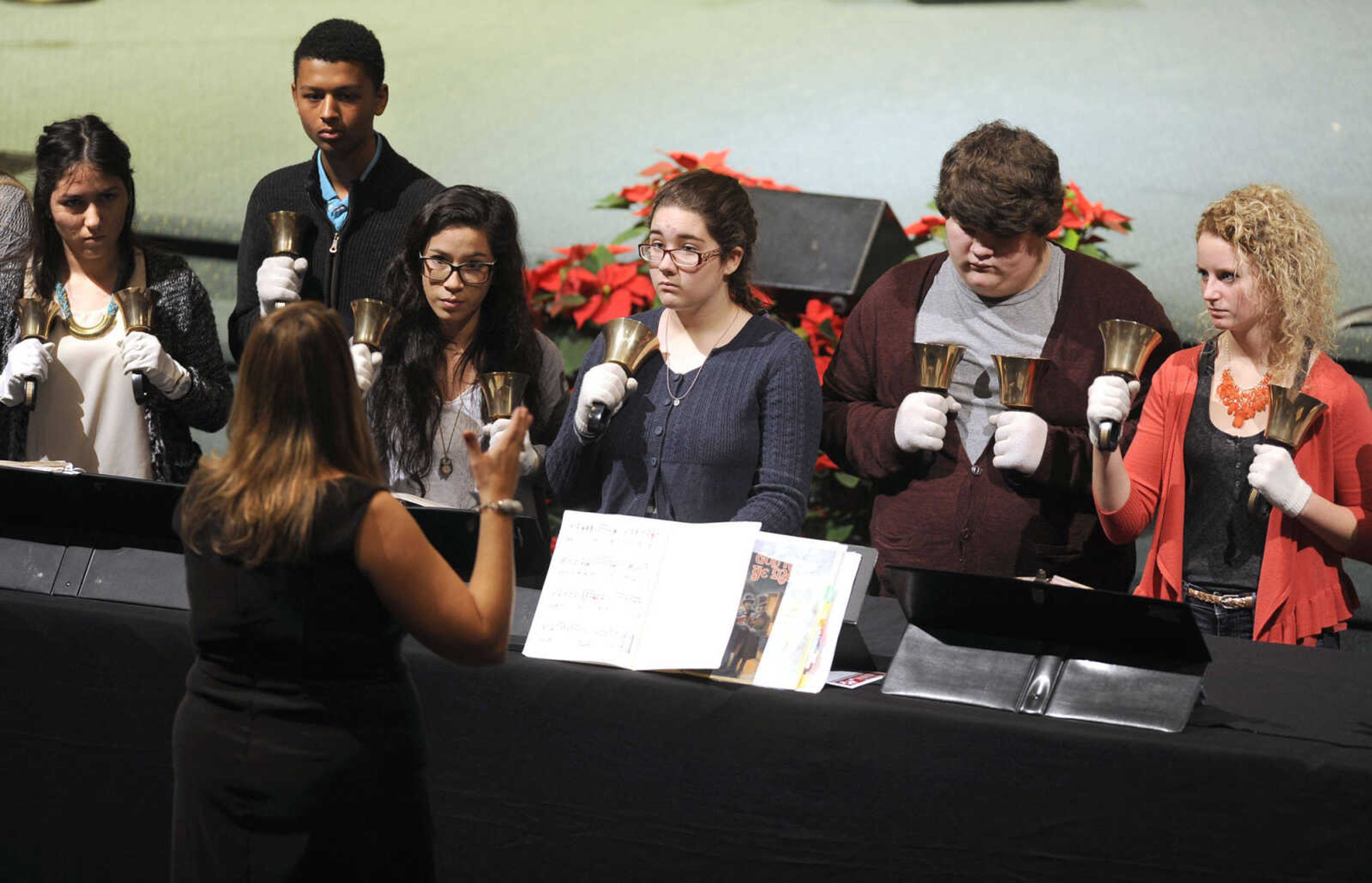 Beth St. John directs the Jackson High School Hand Bell Choir in the prelude to the Sounds of the Season Christmas concert Sunday, Dec. 7, 2014 at Cape Bible Chapel in Cape Girardeau.