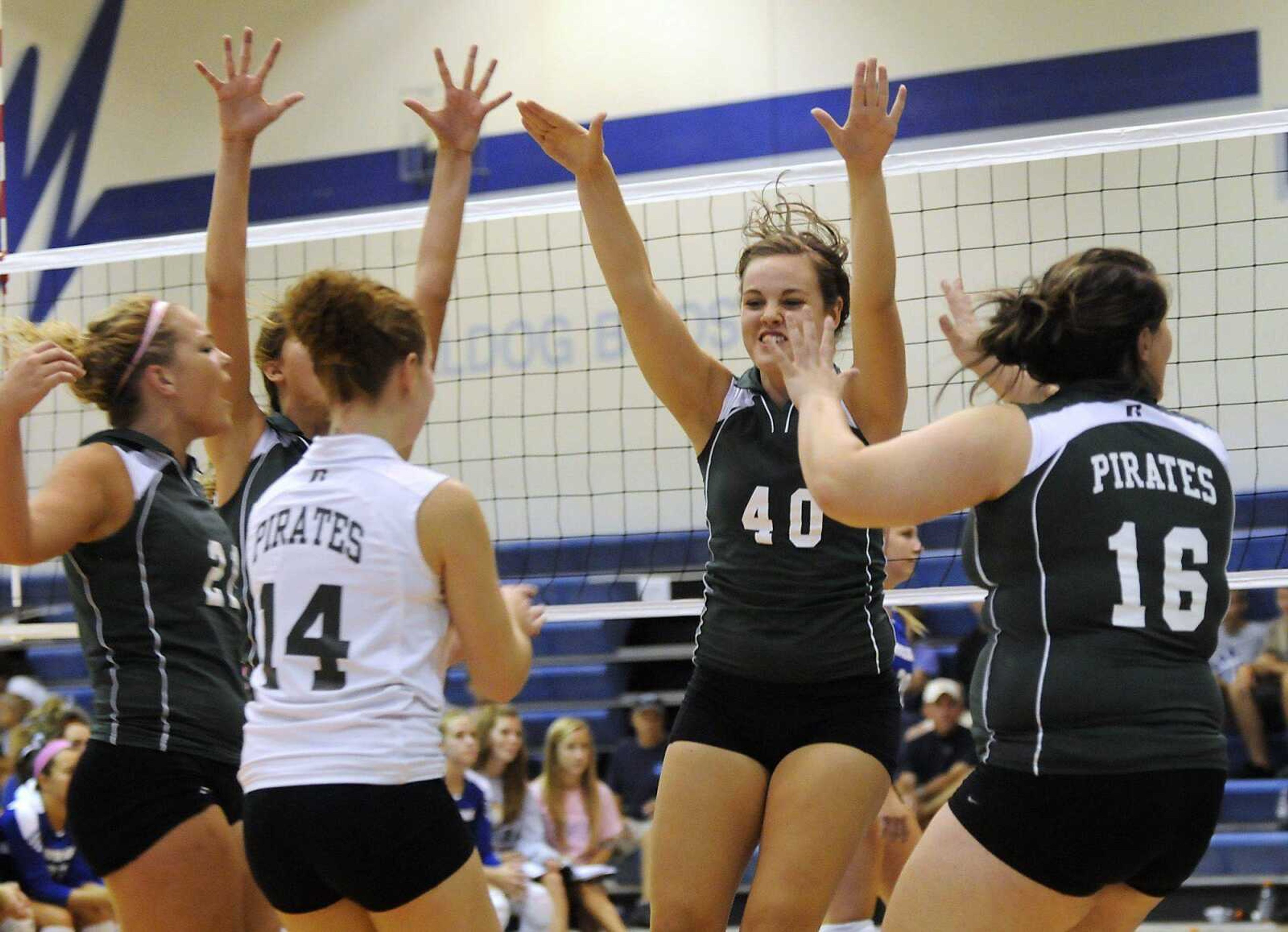 Perryville players celebrate a point against Notre Dame during the first game of the Notre Dame VolleyballFest title match Saturday. (Kristin Eberts)