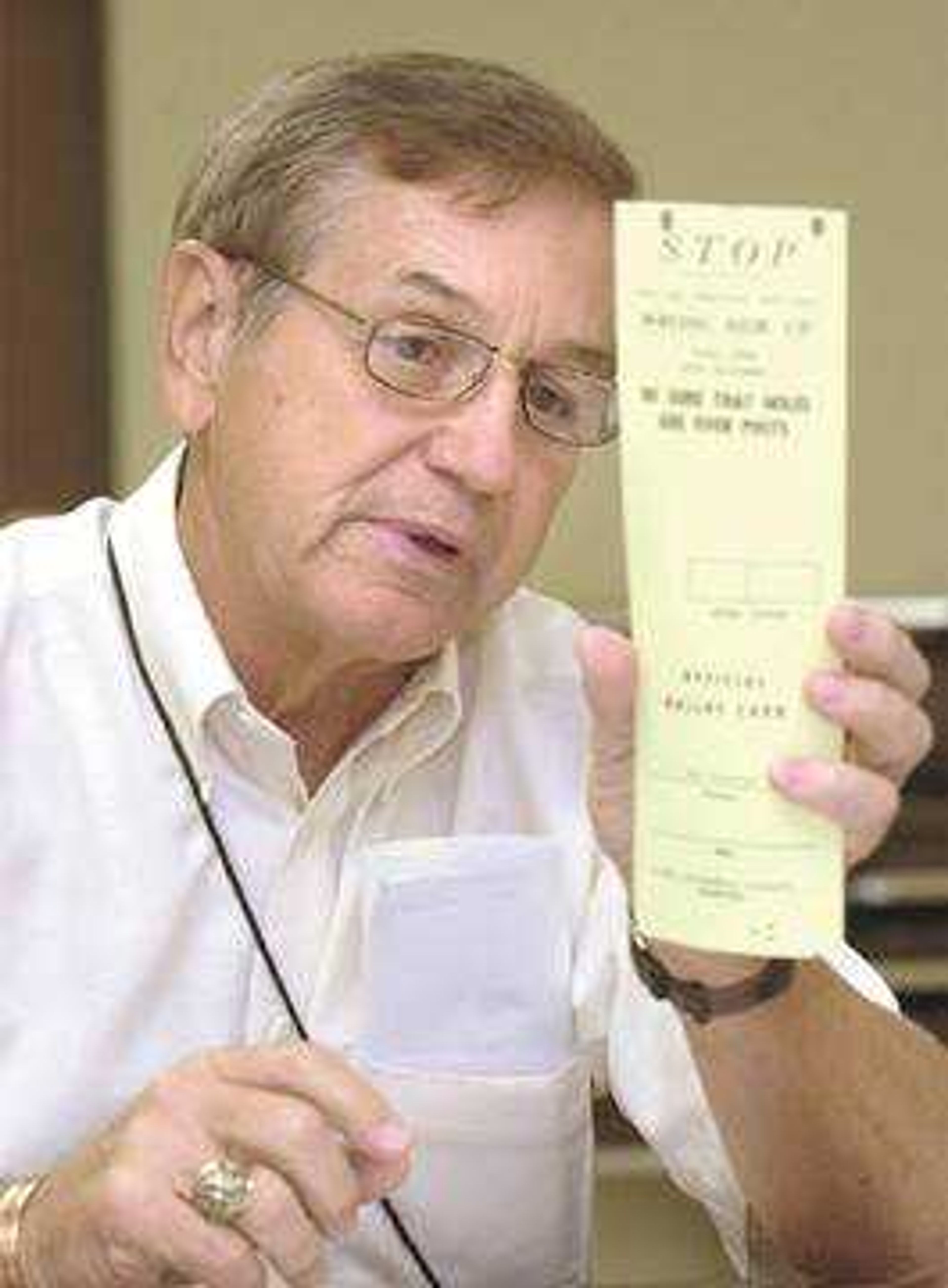 Cape Girardeau County Clerk Rodney Miller held up a sample ballot while explaining the recount process to the election judges.