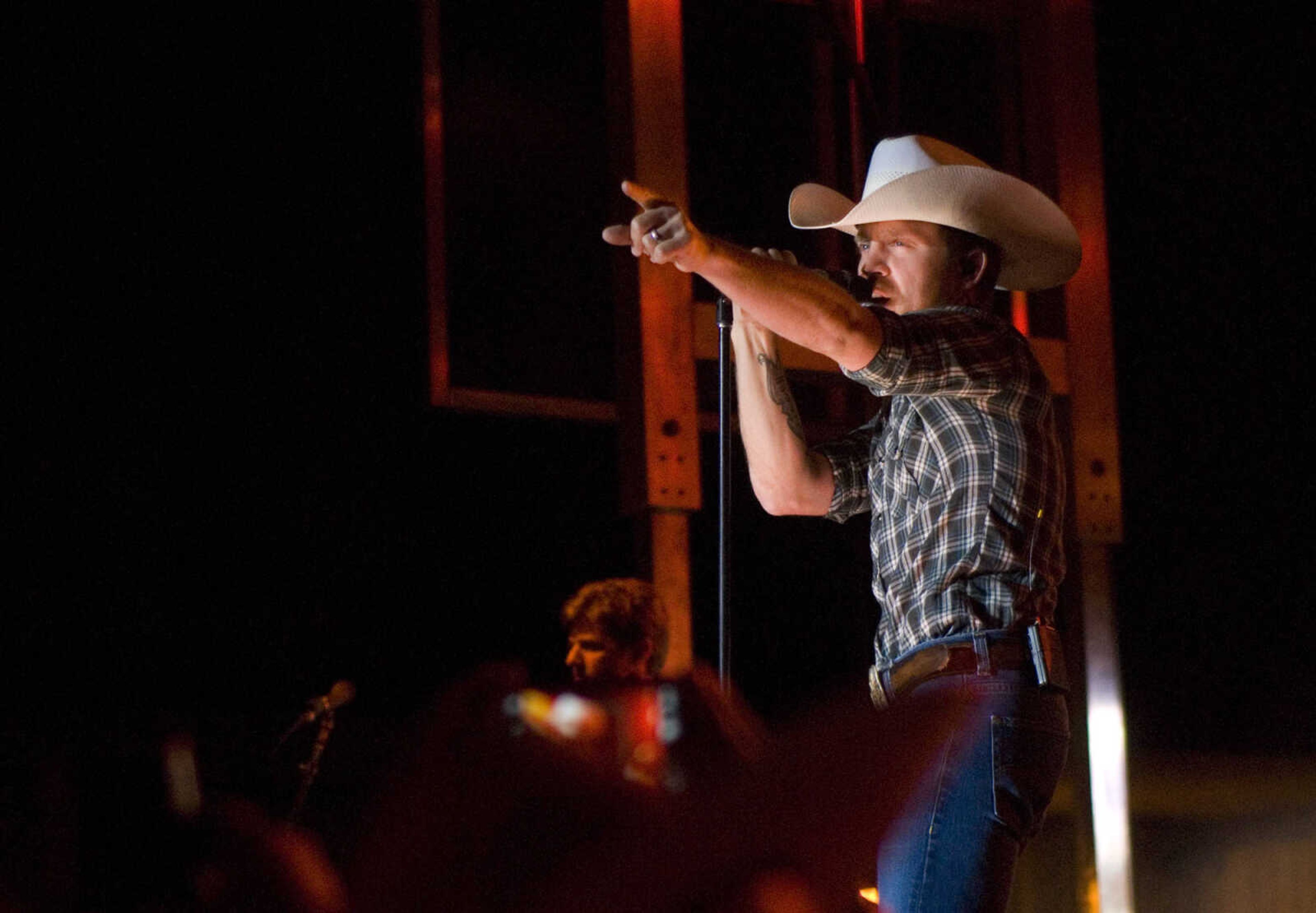 AARON EISENHAUER ~ photos@semissourian.com

Country music star Justin Moore performs for fans on the outdoor stage at Bootheel Harley-Davidson on Friday, July 12, 2013 in Scott City.