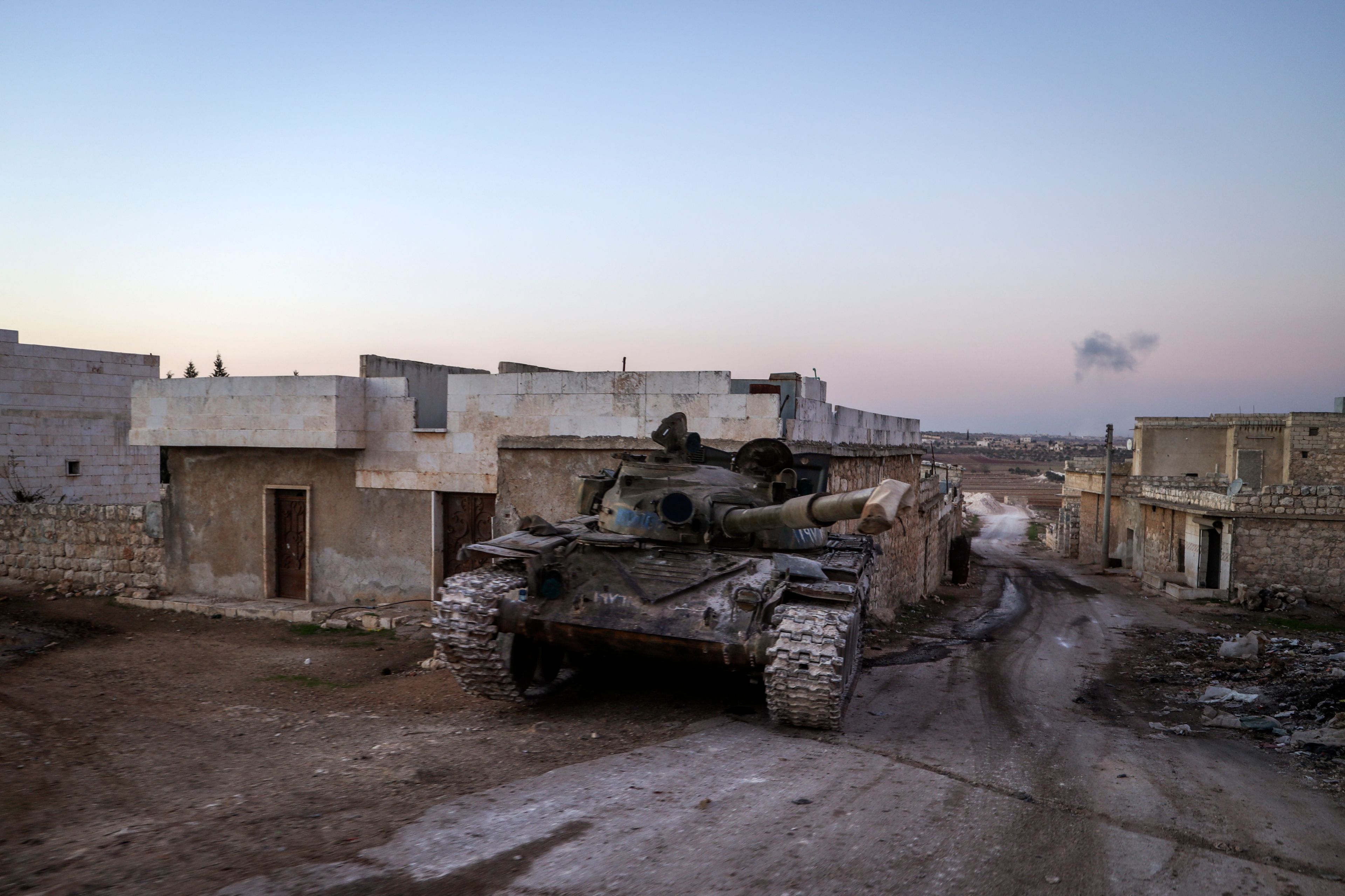 A destroyed Syrian army tank sits in the village of Anjara, western outskirts of Aleppo, Syria, Thursday Nov. 28, 2024. (AP Photo/Omar Albam)