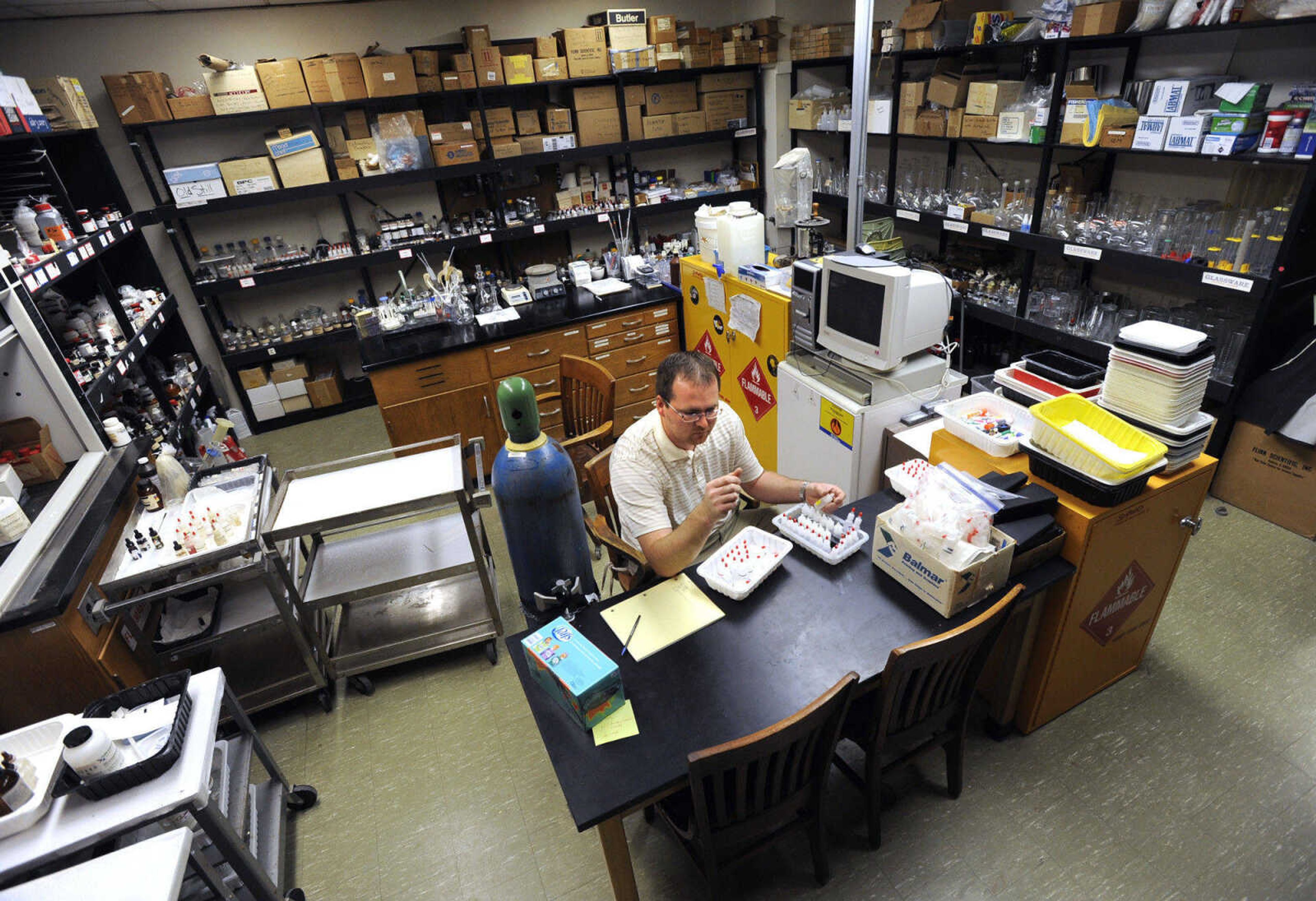 FRED LYNCH ~ flynch@semissourian.com
Dr. Nathan Calkins, chemistry instructor, shows the crowded chemical stock room at Mineral Area College in Park Hills, Mo.