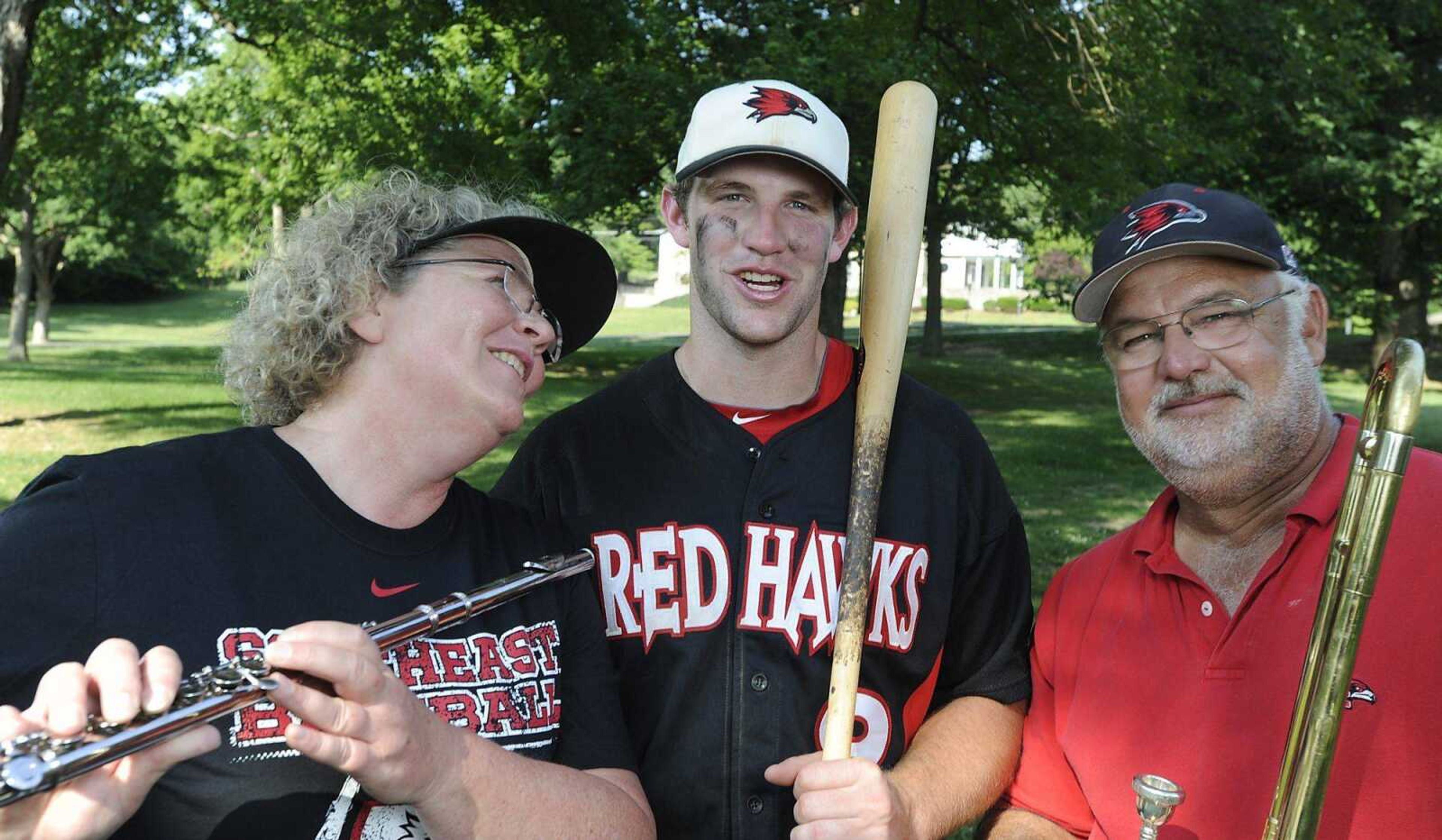 Lisa and Bob Moses met while playing in the band as students at Southeast Missouri State. Their older son, Trenton, center, stars for the university's baseball team. (ADAM VOGLER)