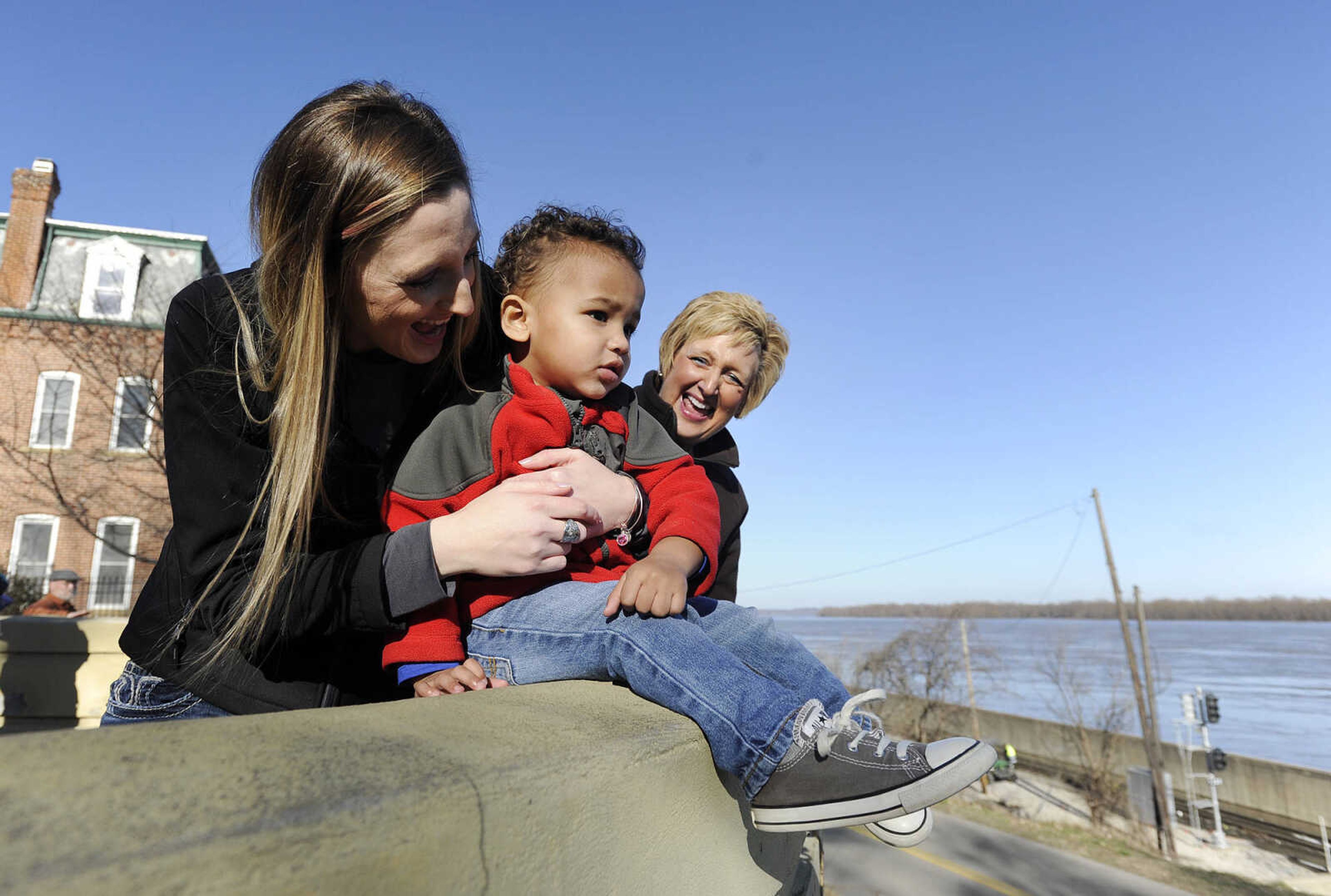 LAURA SIMON ~ lsimon@semissourian.com

Kristin Moore and Quinton Moore, 2, and Rhonda Slaughter have a laugh while looking out over the swollen Mississippi River, Saturday, Jan. 2, 2016, in Cape Girardeau.