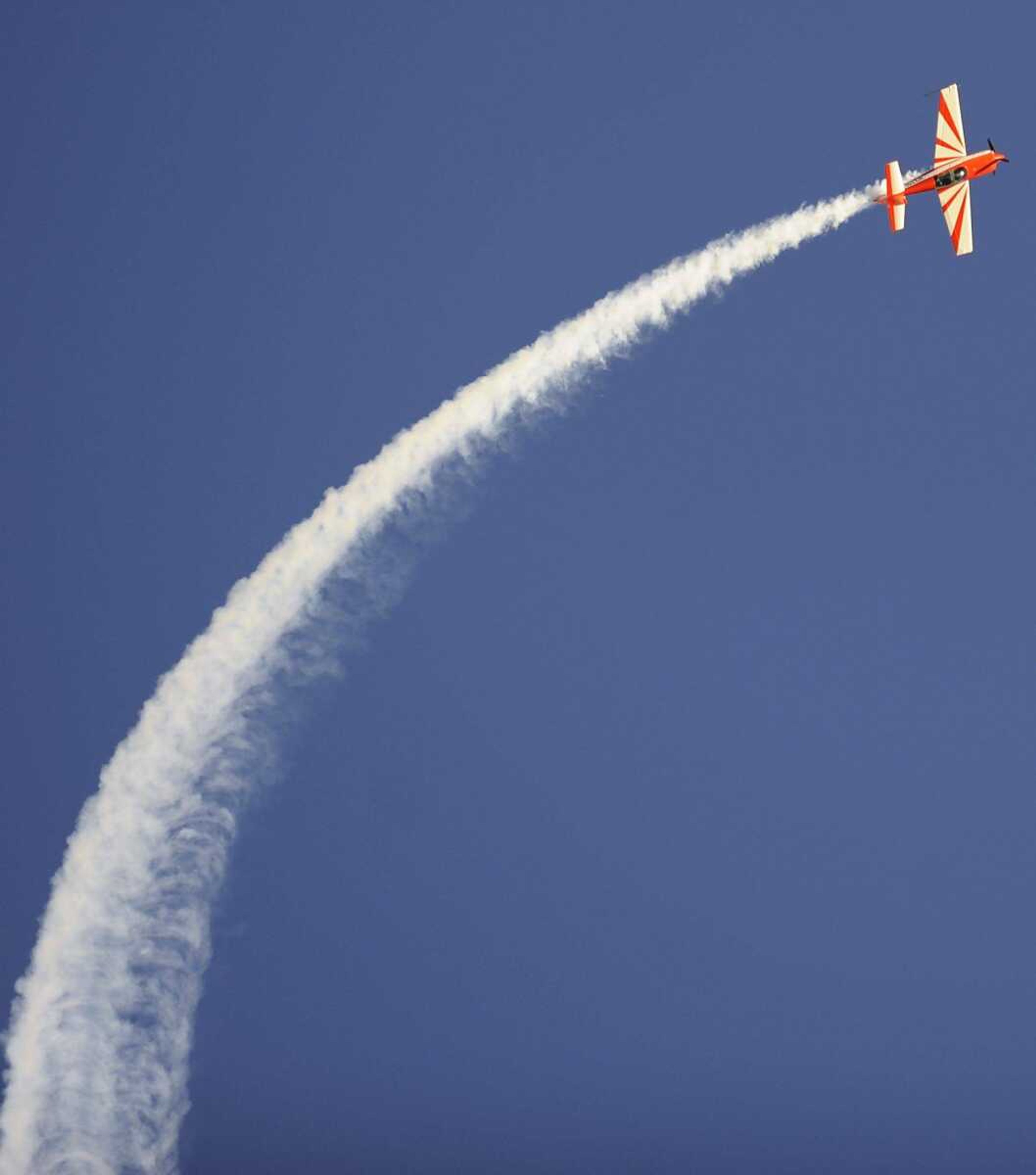 Wayne Roberts performs in his Extra 330LX at the 2013 Cape Girardeau Regional Air Festival Friday, June 28, at the Cape Girardeau Regional Airport. T (Adam Vogler)