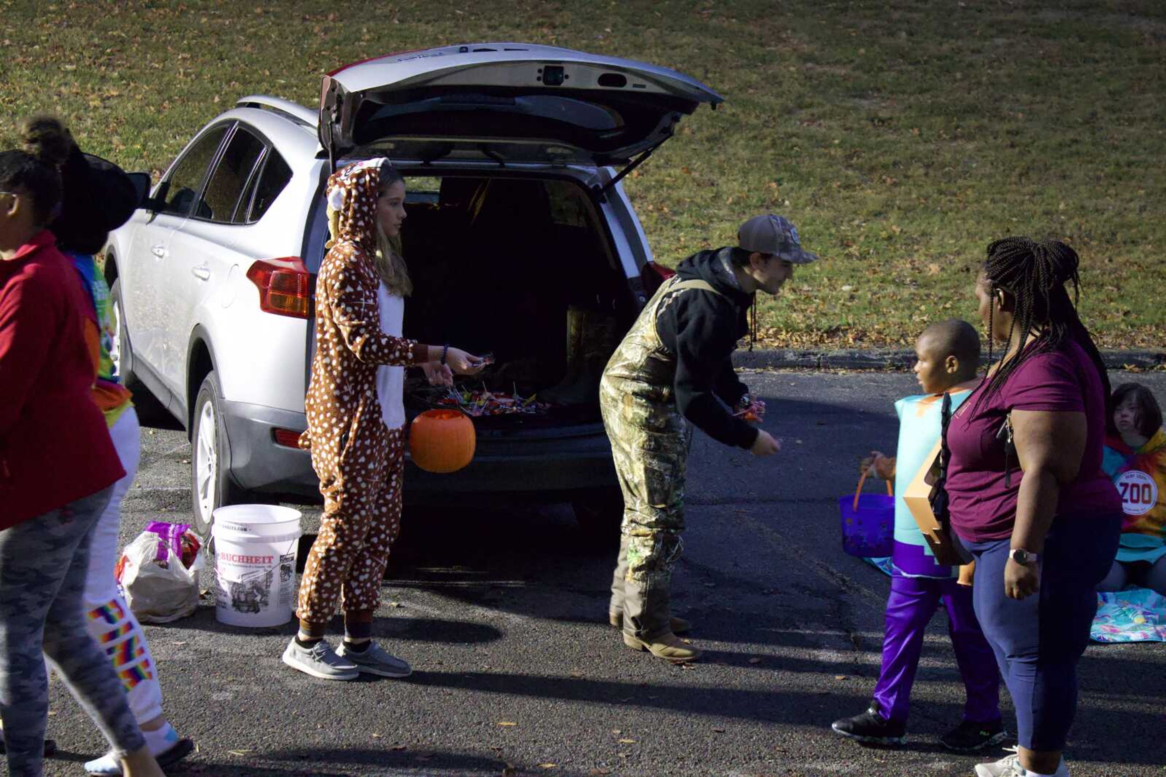 Merideth
 Roseman and Gavin Schott hand out candy from their 
SUV on Monday, Oct. 31 at Lynwood Baptist Church. Gavin suited up as a camouflage hunter while Merideth dressed as a 
deer. (Photo by Jeffery Long)