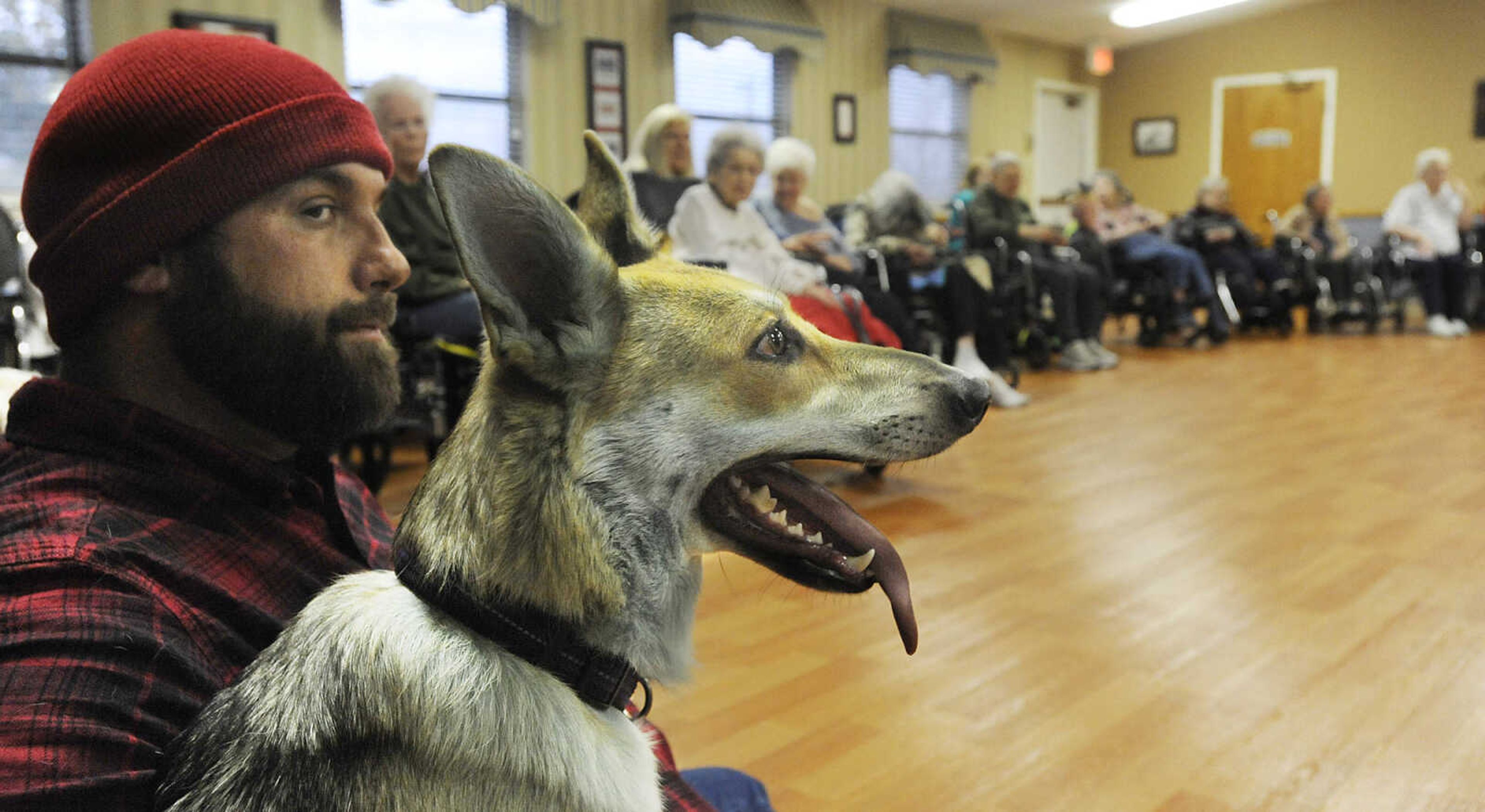 Chris Darby and Bella, a German Shepherd, visit with residents during the Howl-oween Pet Parade Friday, October 26, at the Chaffee Nursing Center, in Chaffee. Darby and Bella were dressed as Paul Bunyan and Babe, the blue ox. This is the first time the event, where pets and their owners dressed up in costumes to visit residents at the center, has been held. Registration was free but donations were accepted for the Safe Harbor Animal Sanctuary in Jackson.