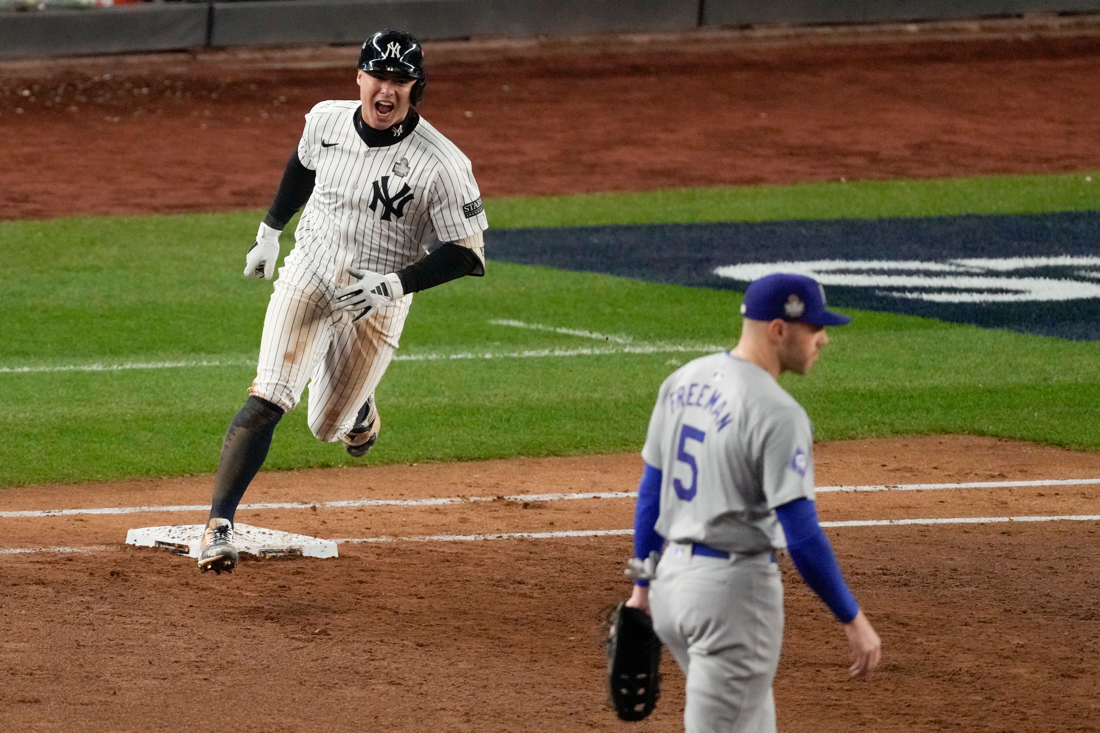 New York Yankees' Anthony Volpe celebrates his grand slam home run against the Los Angeles Dodgers during the third inning in Game 4 of the baseball World Series, Tuesday, Oct. 29, 2024, in New York. (AP Photo/Frank Franklin II)