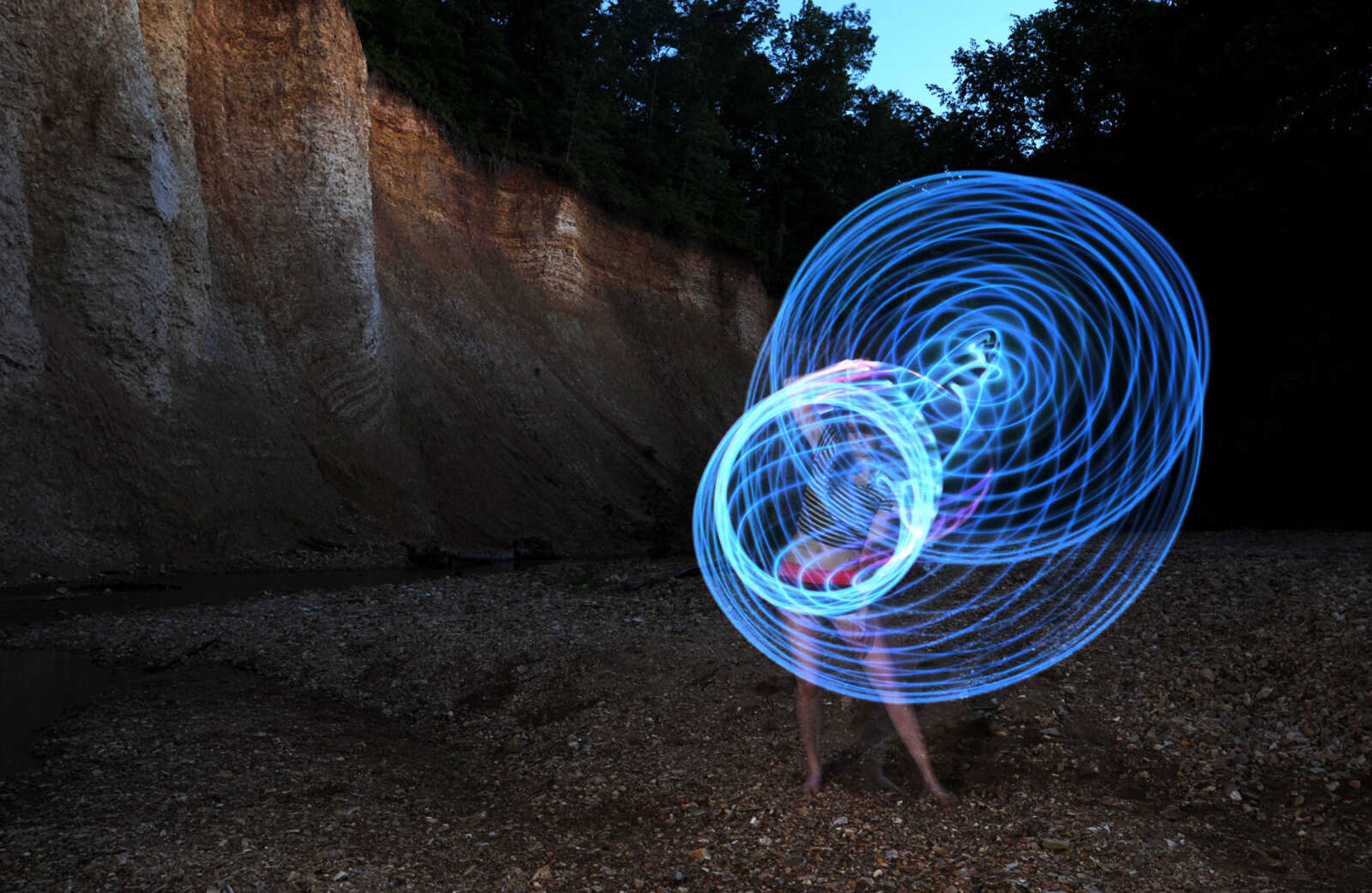 LAURA SIMON ~ lsimon@semissourian.com

Chelsie Welker hoop dances with an LED hoop in a Cape Girardeau County creek, Tuesday, May 26, 2015.