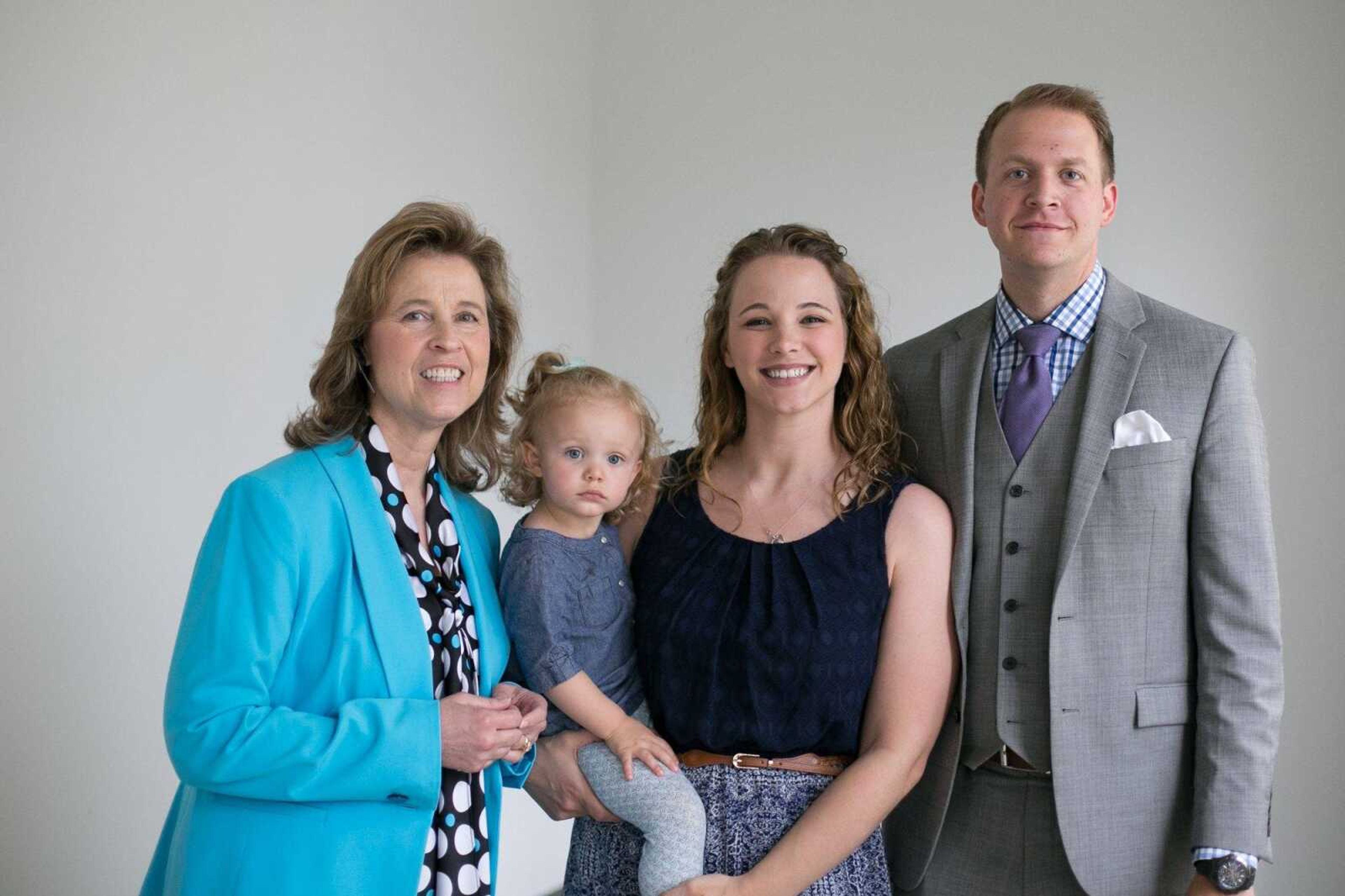 Lauren and Travis Grammer pose for a photo with their daughter and real estate agent Elaine Edgar on Friday at the Southeast Missourian. (Glenn Landberg)