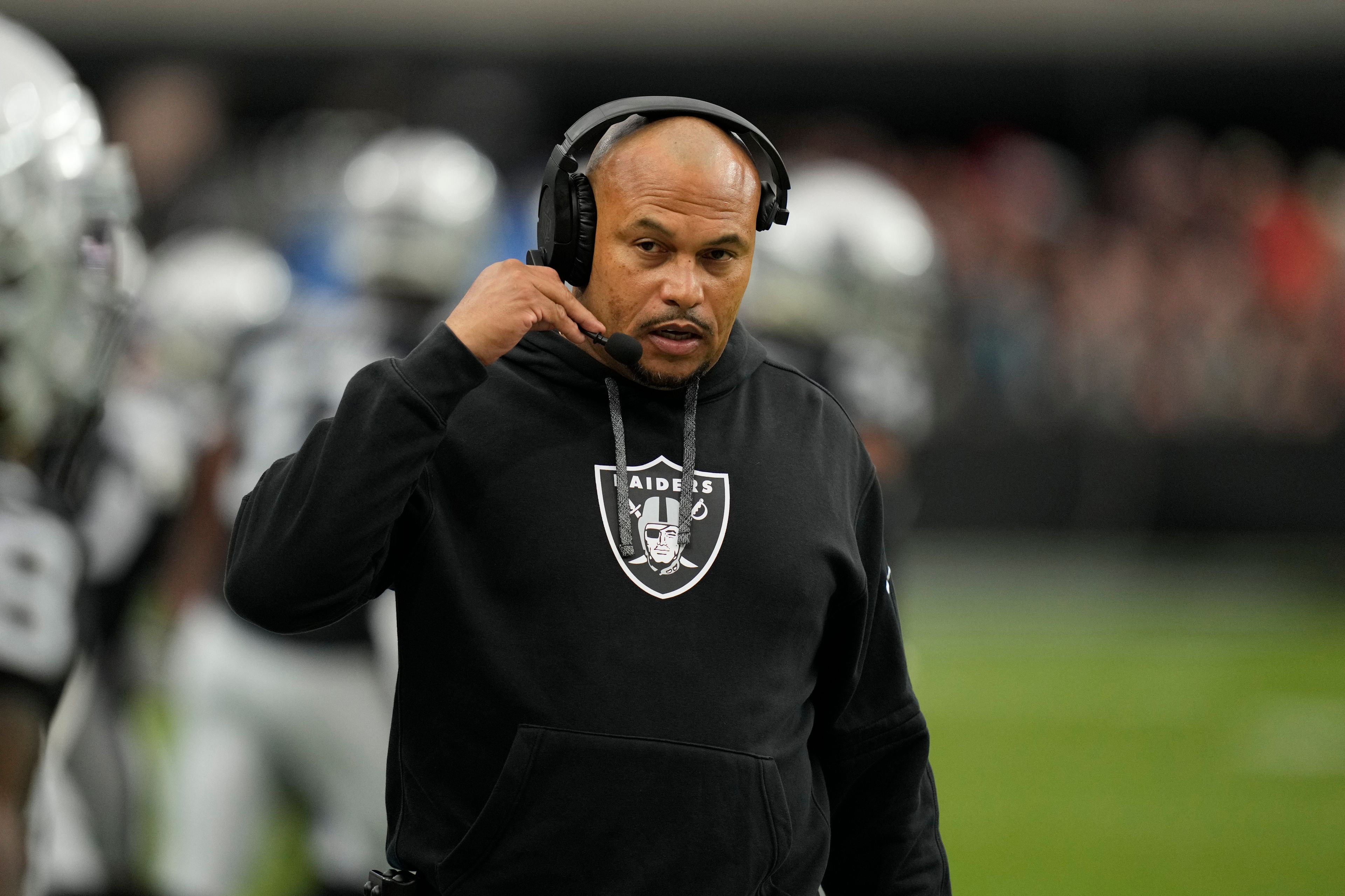 Las Vegas Raiders head coach Antonio Pierce watches from the sidelines during the first half of an NFL football game against the Kansas City Chiefs Sunday, Oct. 27, 2024, in Las Vegas. (AP Photo/John Locher)