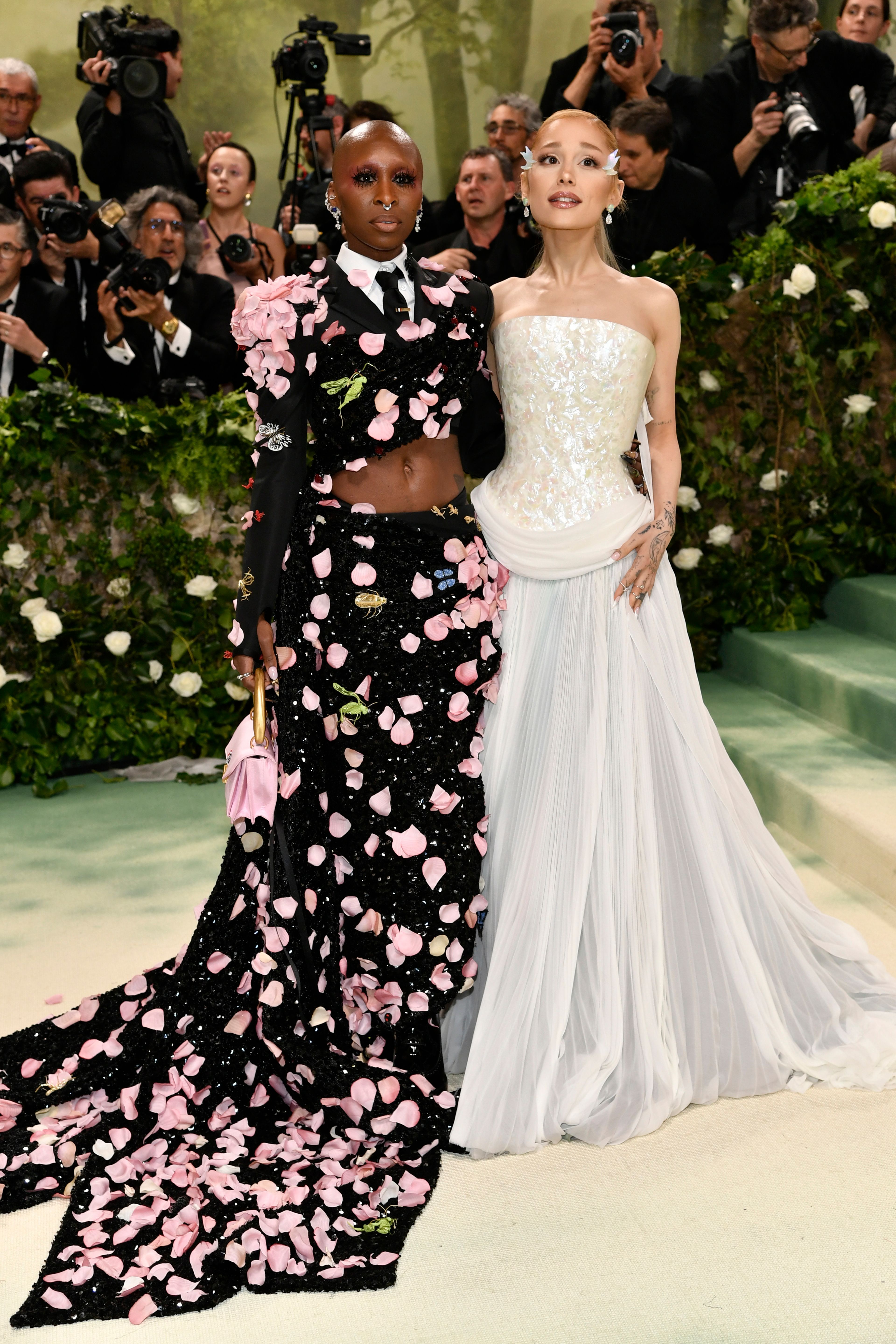 FILE -Cynthia Erivo, left, and Ariana Grande attend The Metropolitan Museum of Art's Costume Institute benefit gala on Monday, May 6, 2024, in New York. In “Wicked,” Elphaba and Glinda travel from Shiz University to the Emerald City on a glistening green train to meet the wizard. In real life, Cynthia Erivo and Ariana Grande have traveled much farther and wider and longer and on airplanes to promote their hotly anticipated film. (Photo by Evan Agostini/Invision/AP, File)