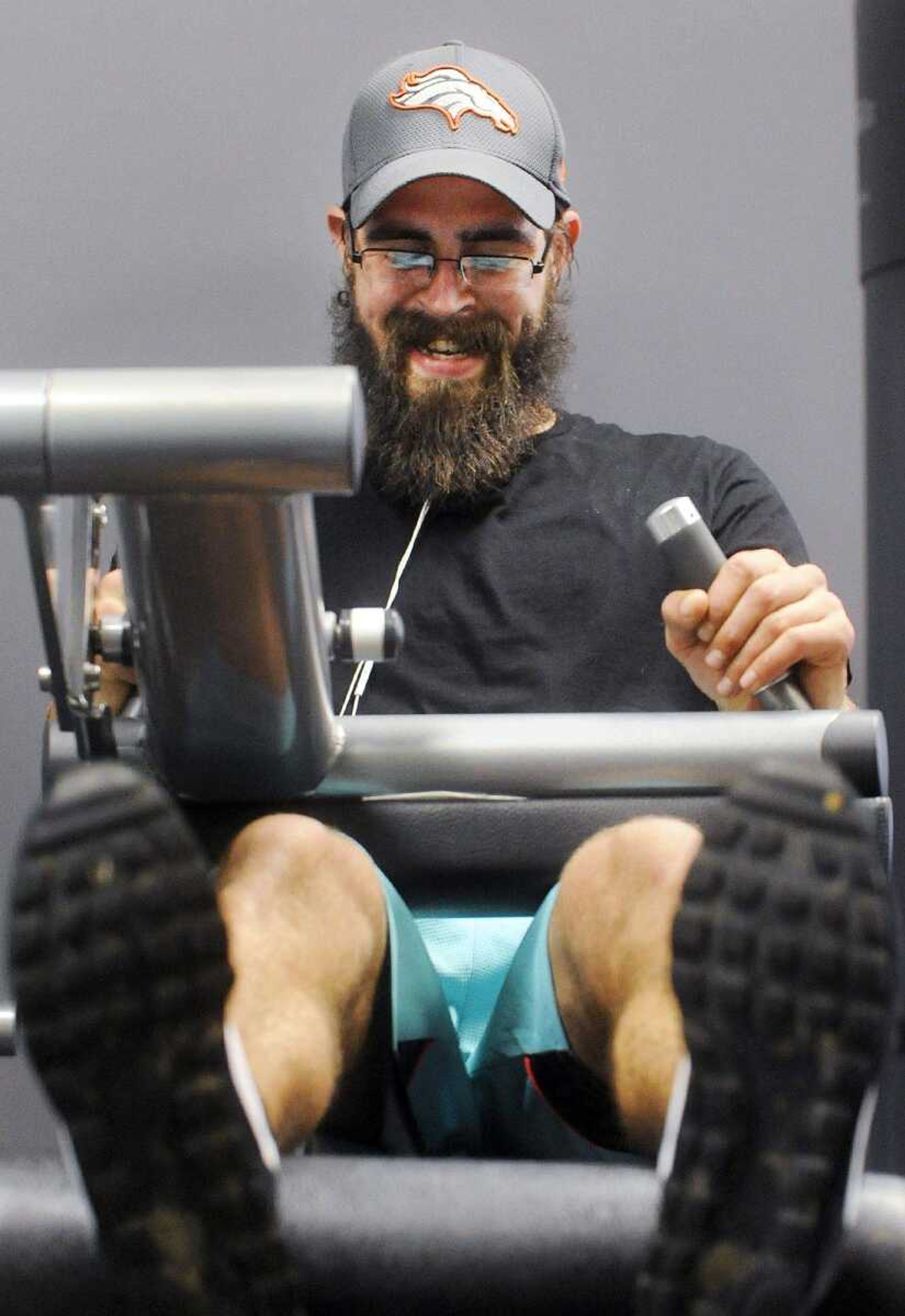 Trevor Kroenung does seated leg curls during his leg day workout at Anytime Fitness in Cape Girardeau. Kroenung works out at least five days a week. (Laura Simon)