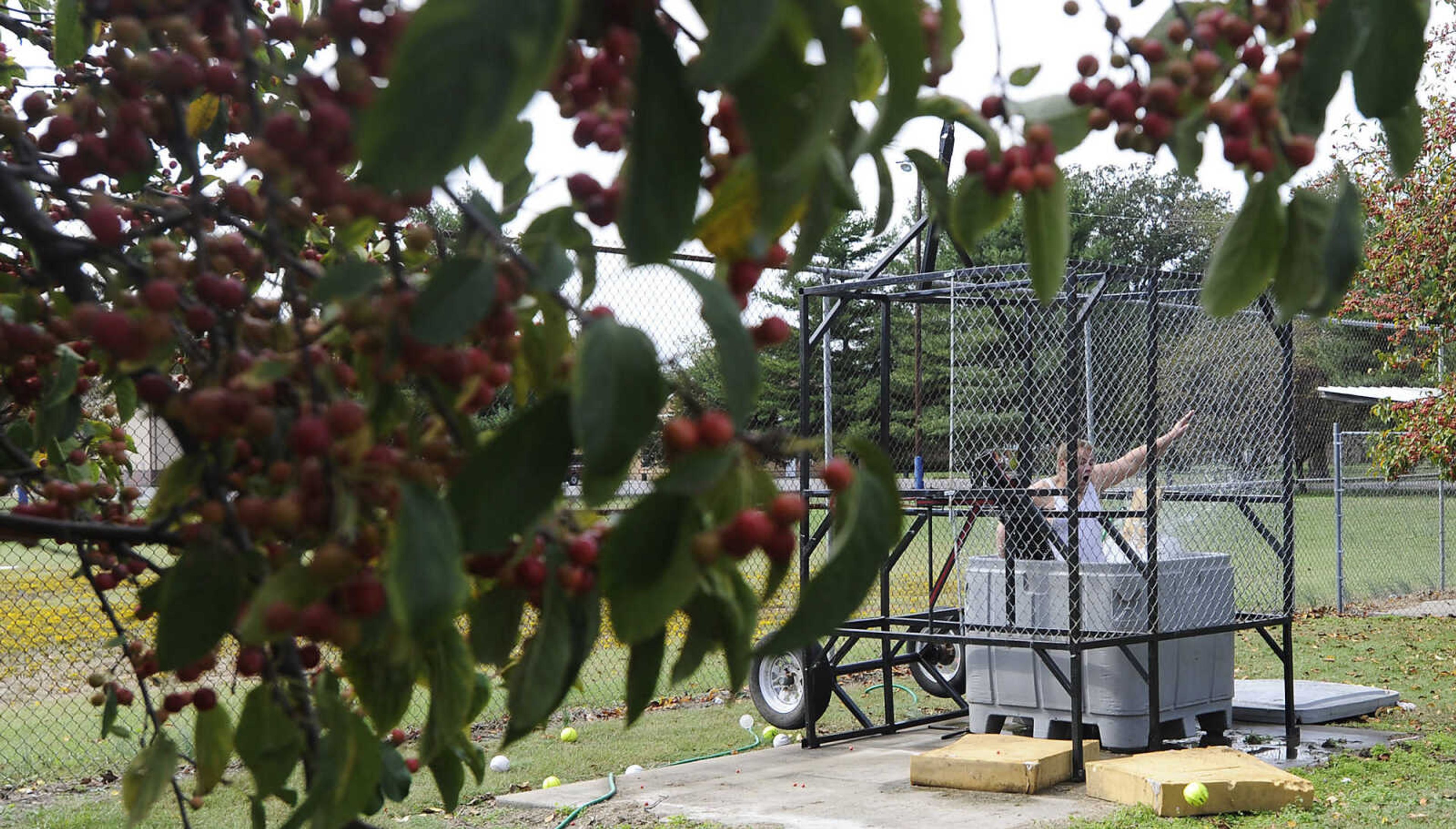 Dustin Penrod splashes down in the dunk tank at the Morley Fall Festival Saturday, October 6, in Morley. The tank was a fundraiser to help Penrod's sister, Shelby attend the National Youth Leadership Forum on Medicine.