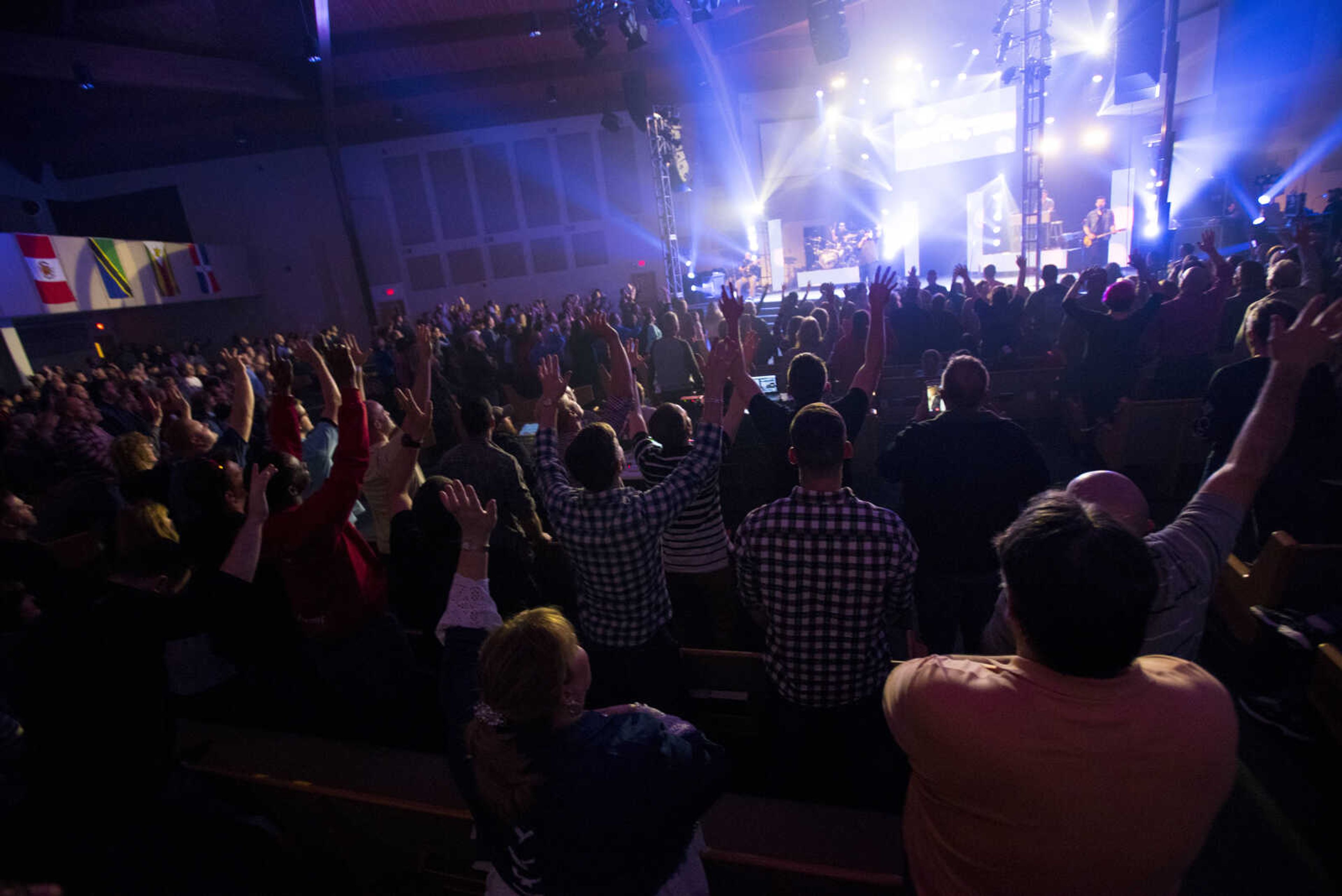 Audience members raise their arms during a Big Daddy Weave concert Wednesday, March 14, 2018, at Cape Bible Chapel in Cape Girardeau.