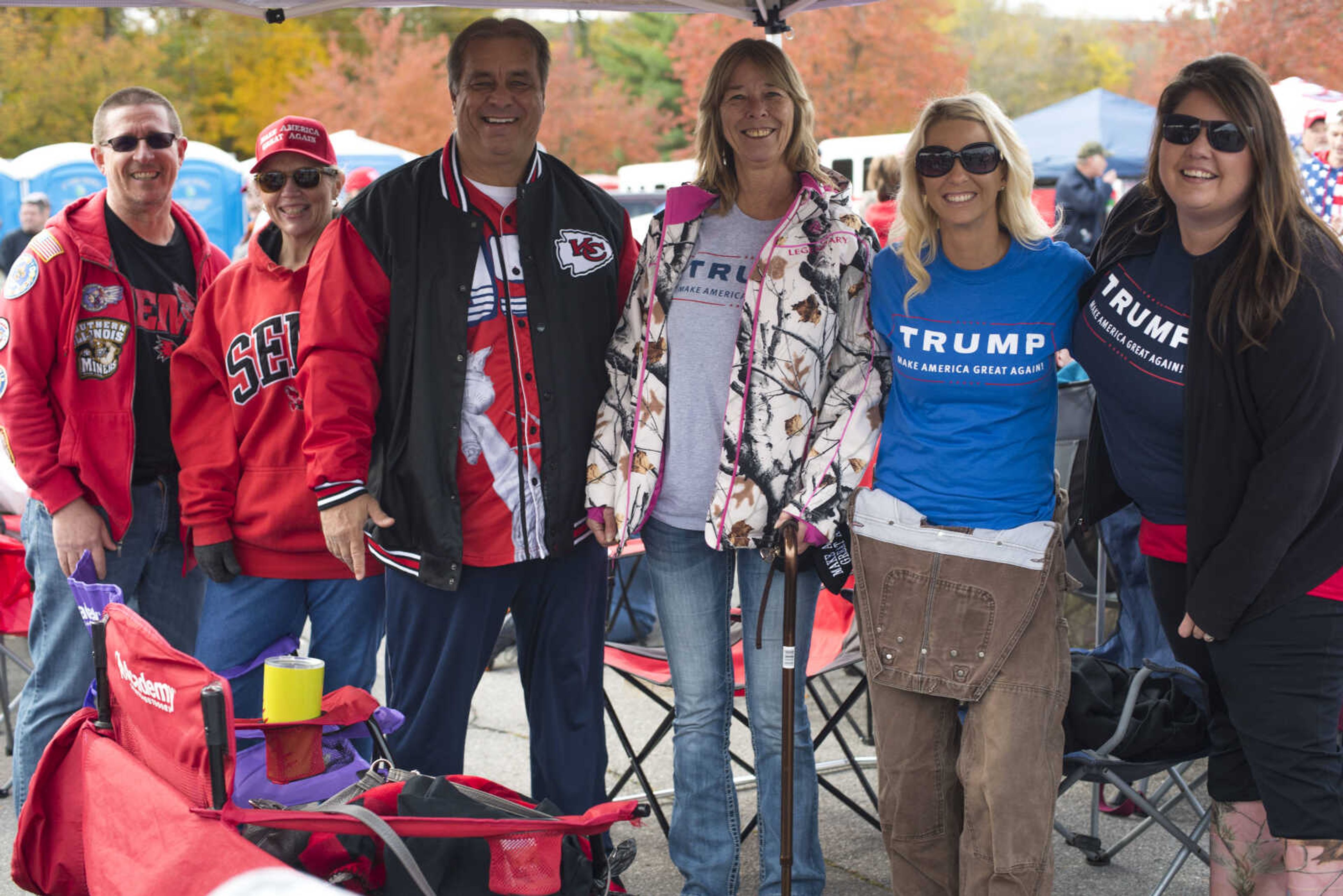 Trump supporters, from left, Don Alpers, Ruth Mauk, Ronnie Hobeck, Diane Blankenship, Nikki VanGennip and Heather Tucker pose for a photo while waiting in line for a Make America Great Again rally Monday, Nov. 5, 2018, at the Show Me Center in Cape Girardeau.